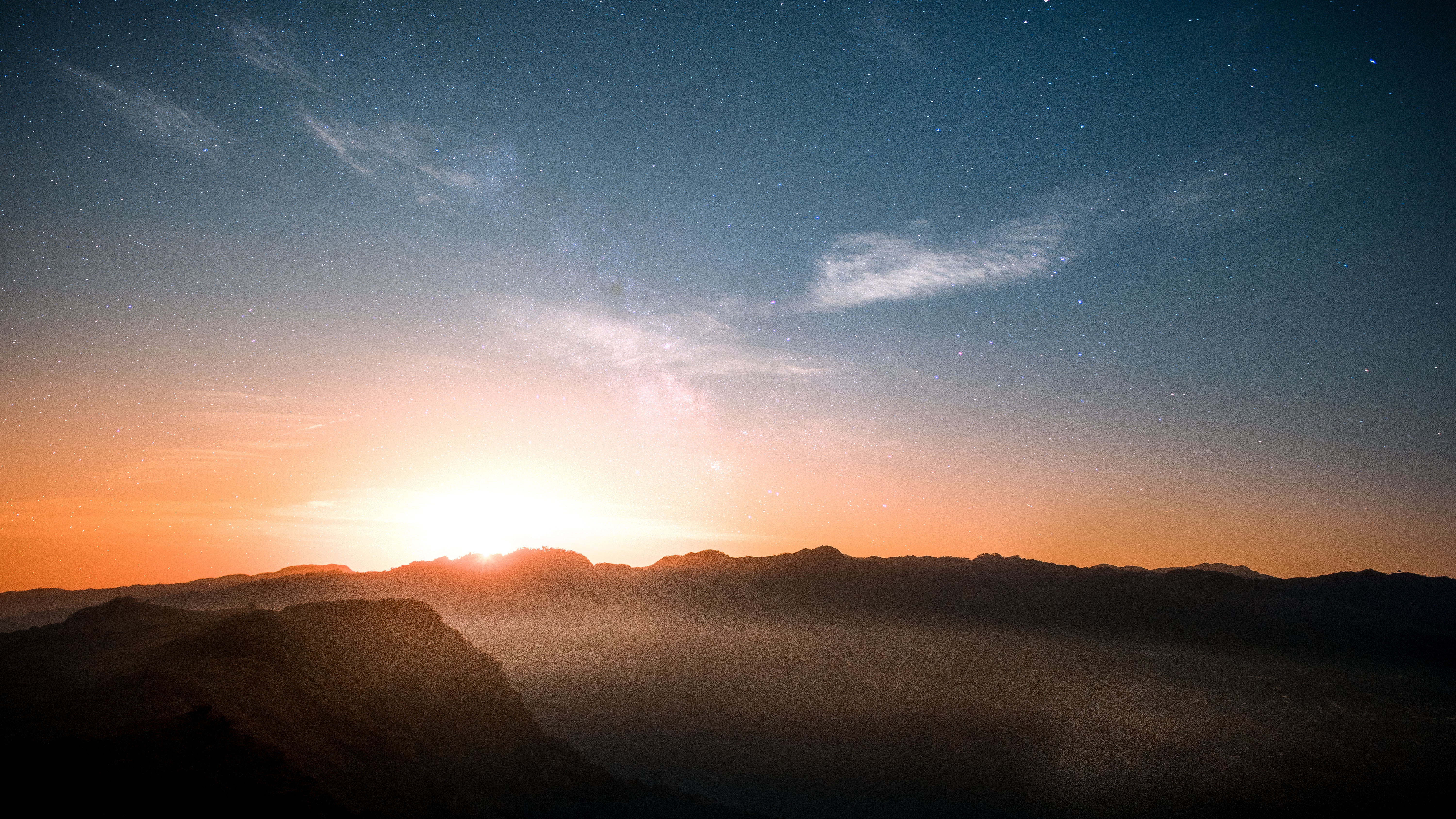 Sunrise over misty mountains with stars in the sky HD Wallpaper