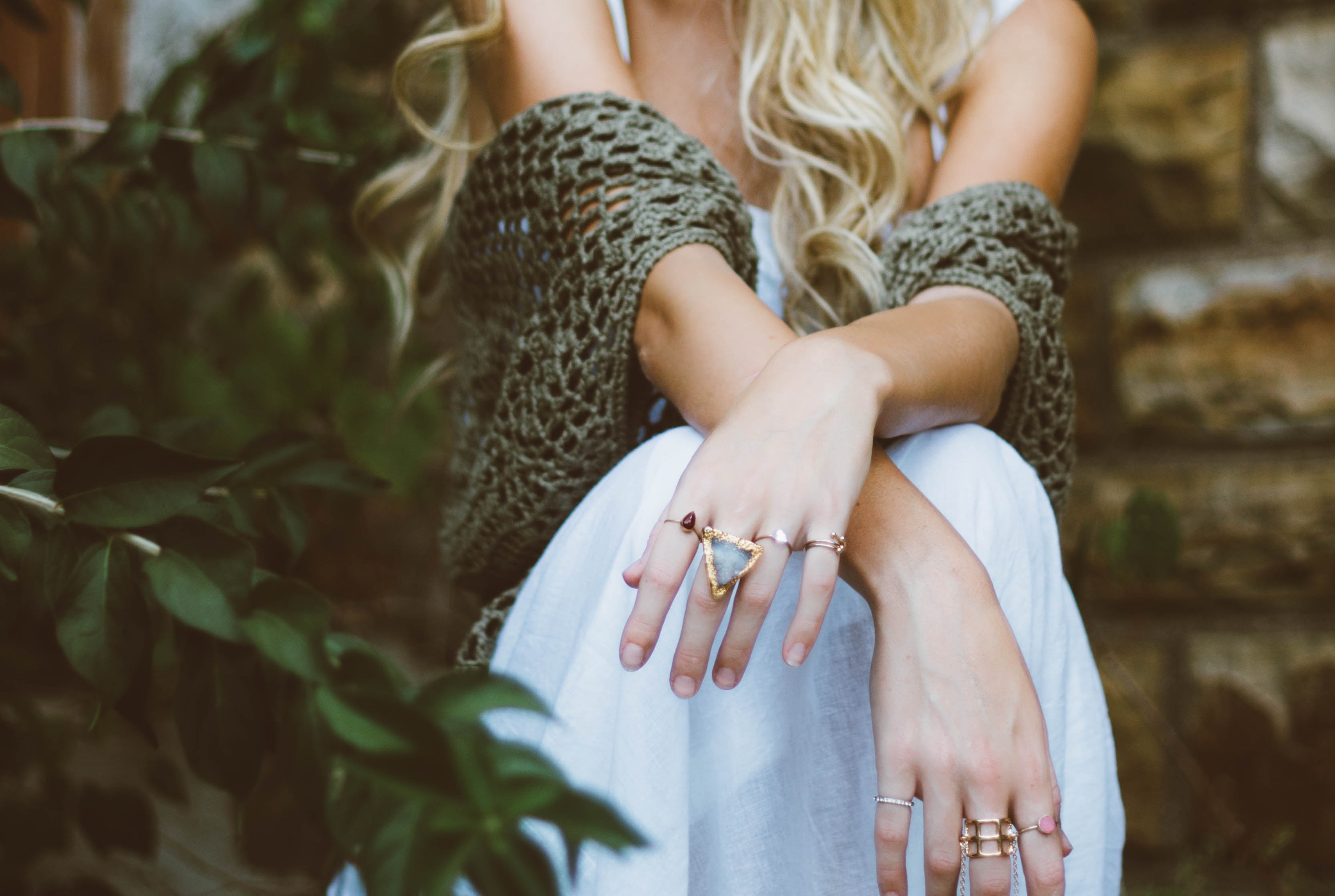 Woman wearing rings and a white dress with foliage HD Wallpaper
