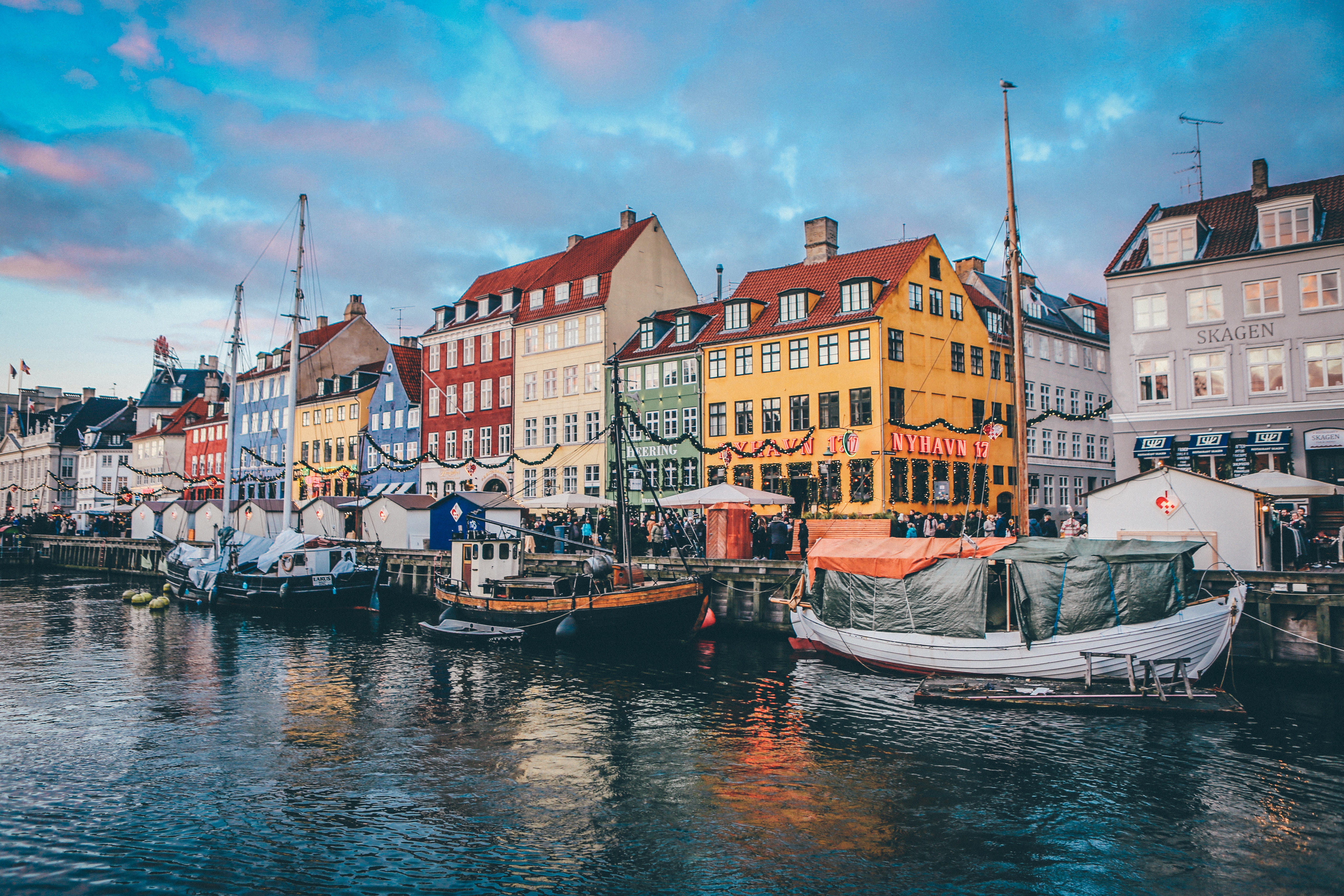 Nyhavn canal in Copenhagen, Denmark with boats and colorful buildings HD Wallpaper