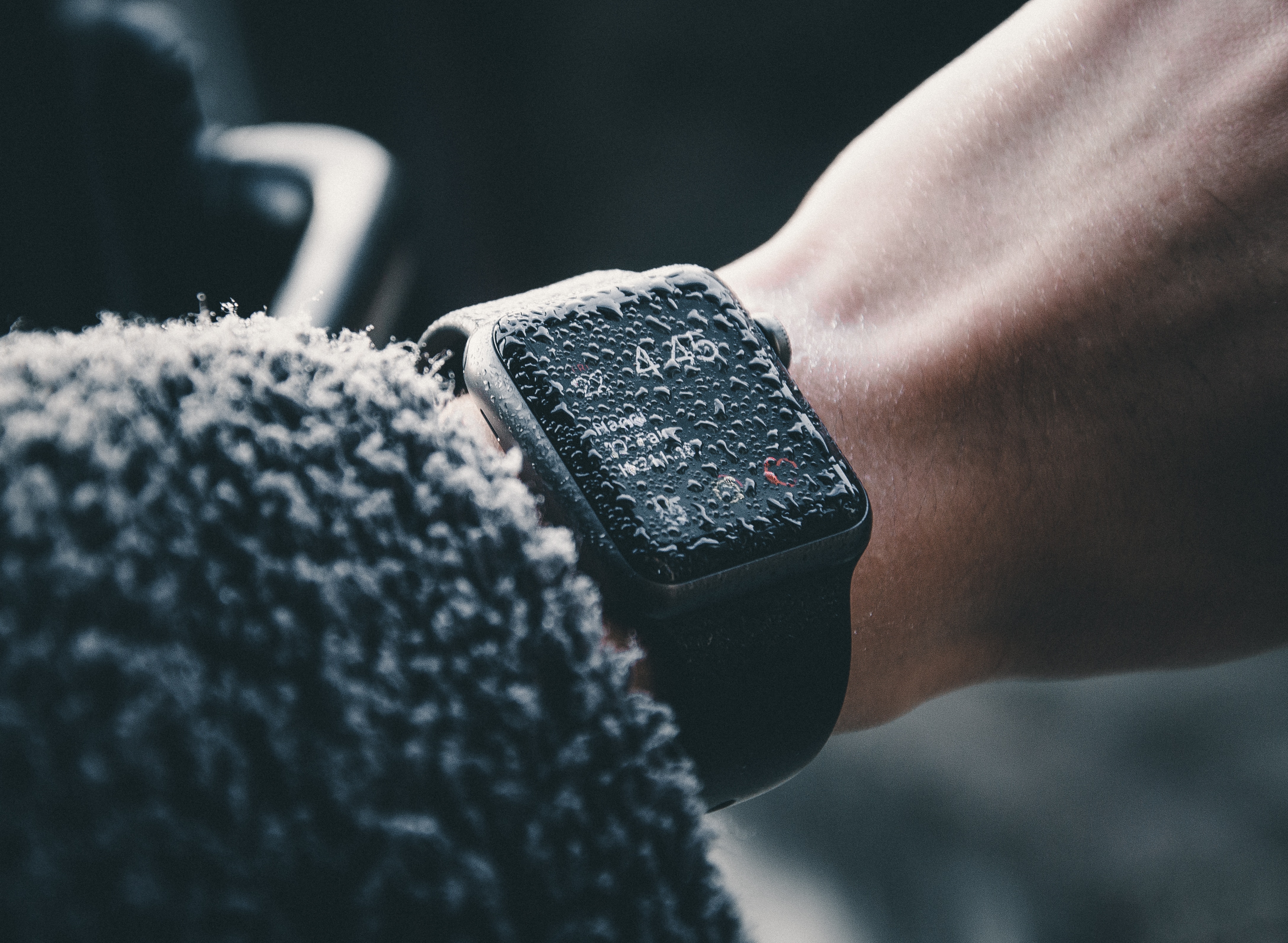 Apple Watch covered in water drops on a wrist HD Wallpaper
