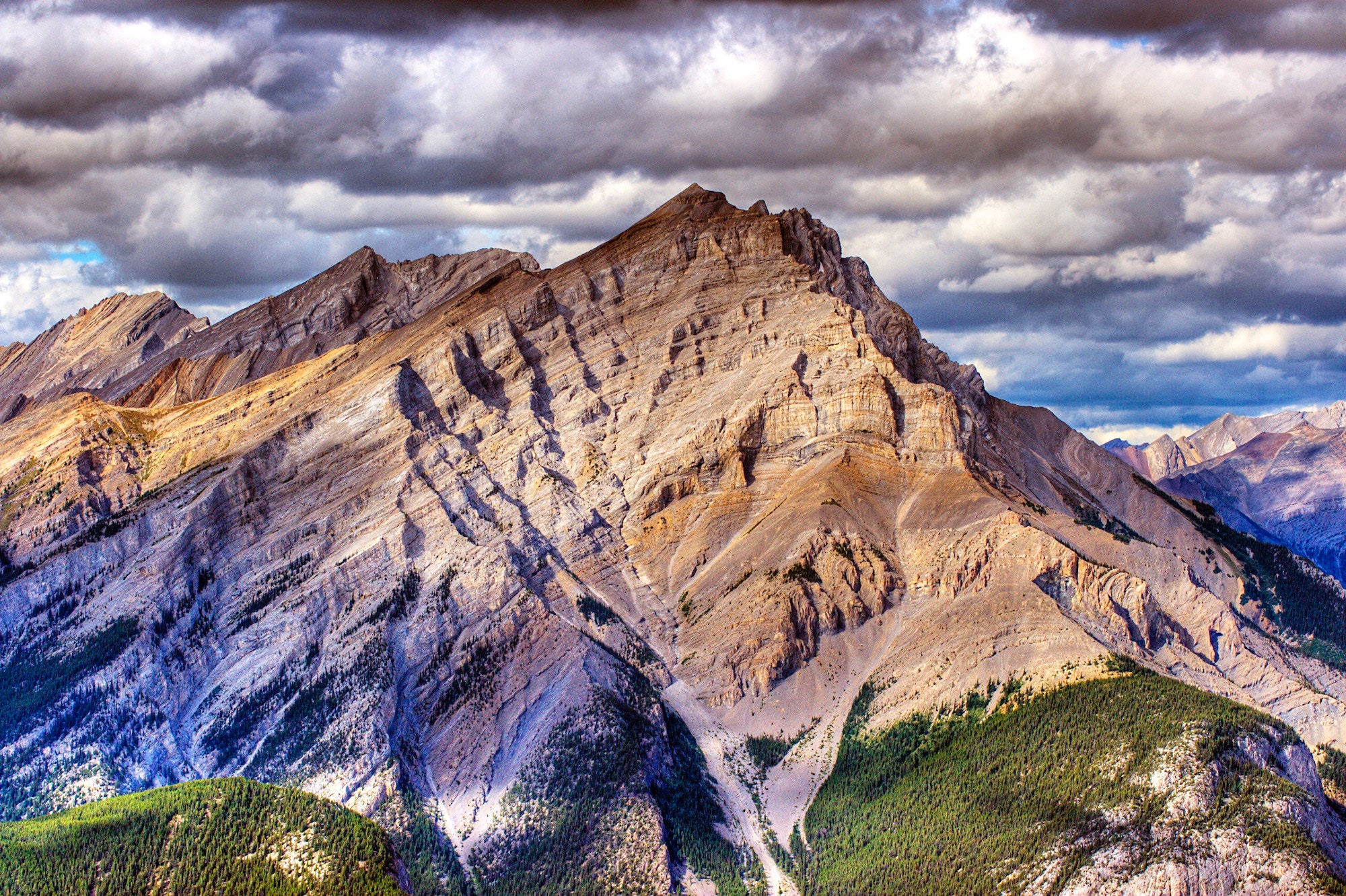 Rocky mountain range with dramatic clouds HD Wallpaper