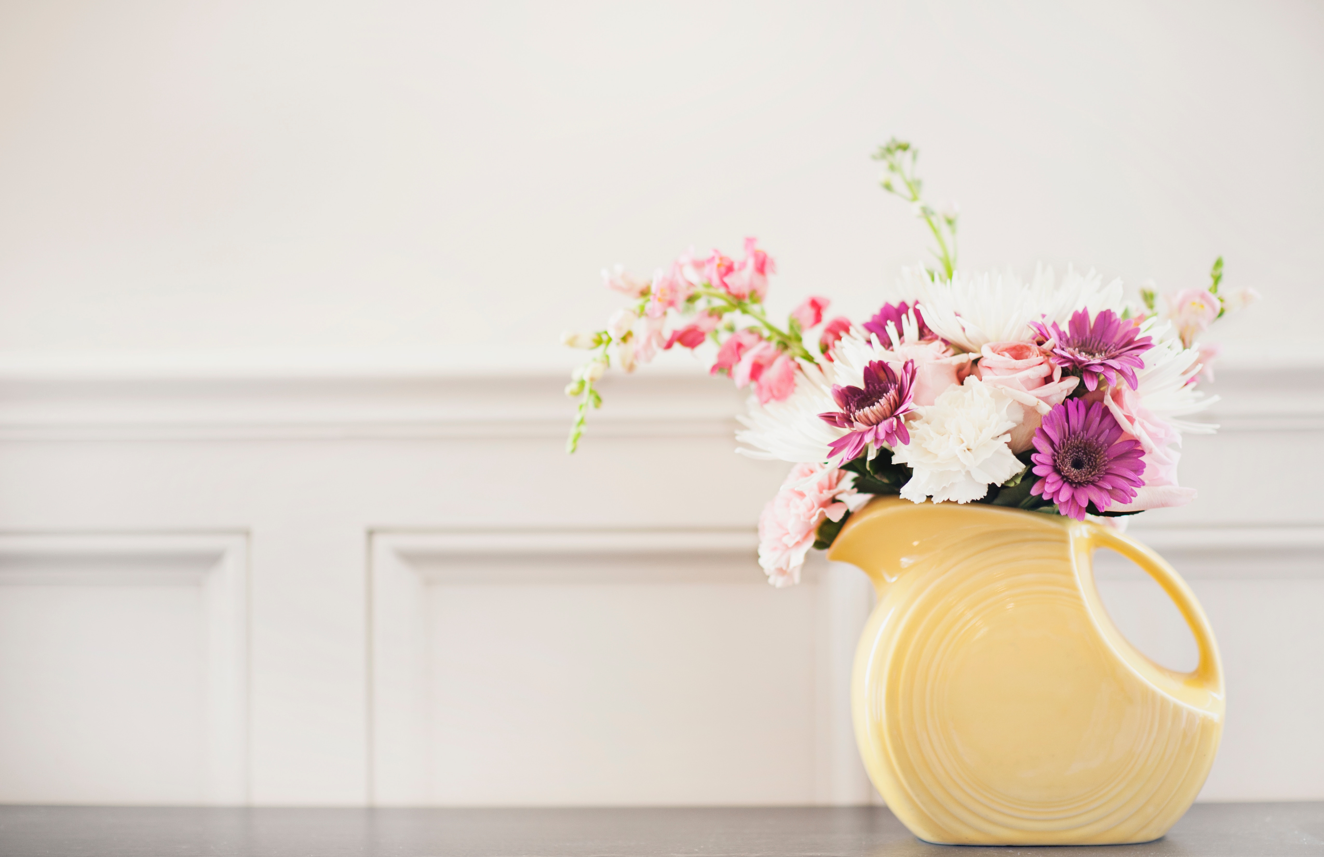 Yellow Fiesta Ware Pitcher with Pink and White Flowers HD Wallpaper
