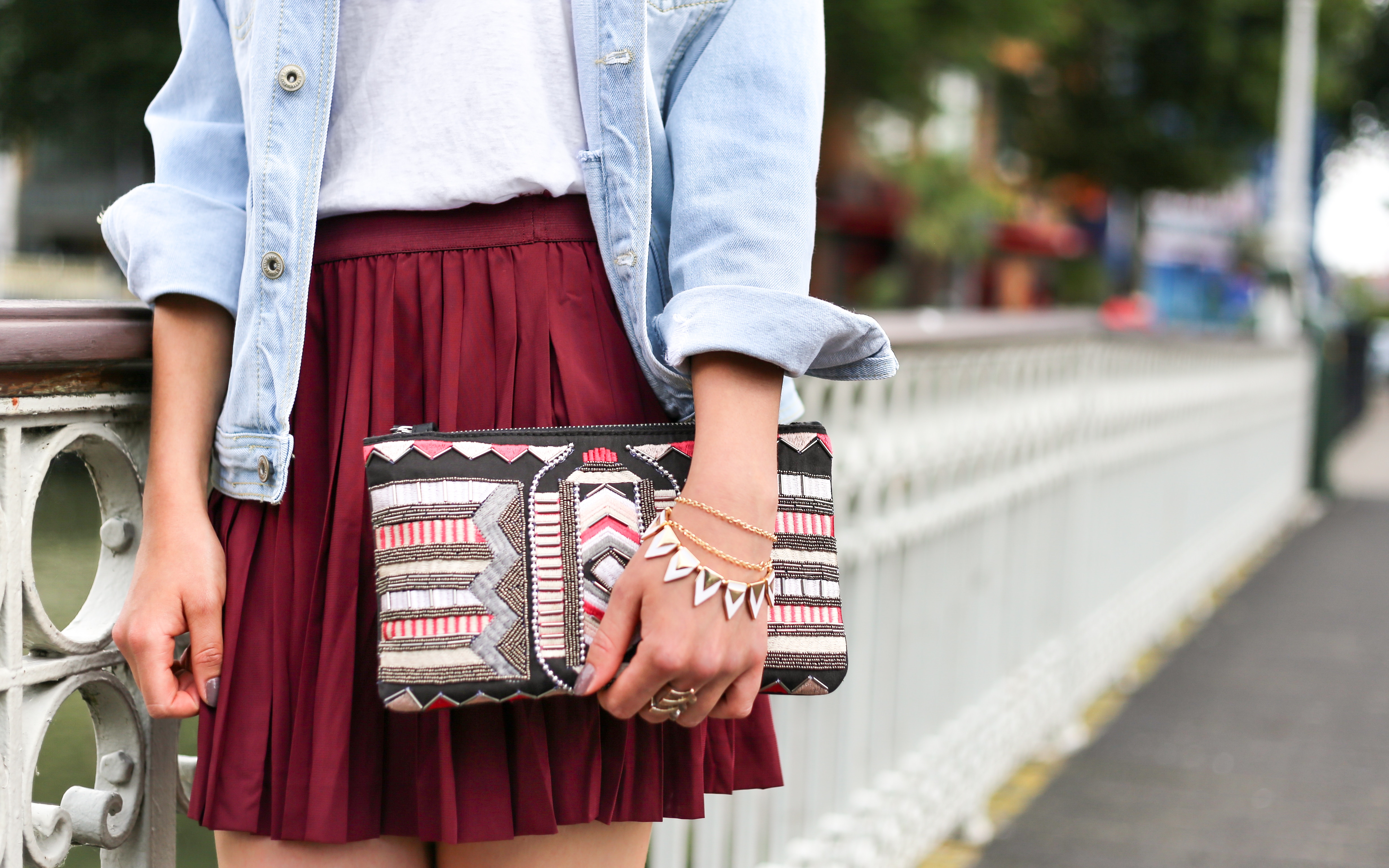 Woman in denim jacket, skirt, and clutch HD Wallpaper
