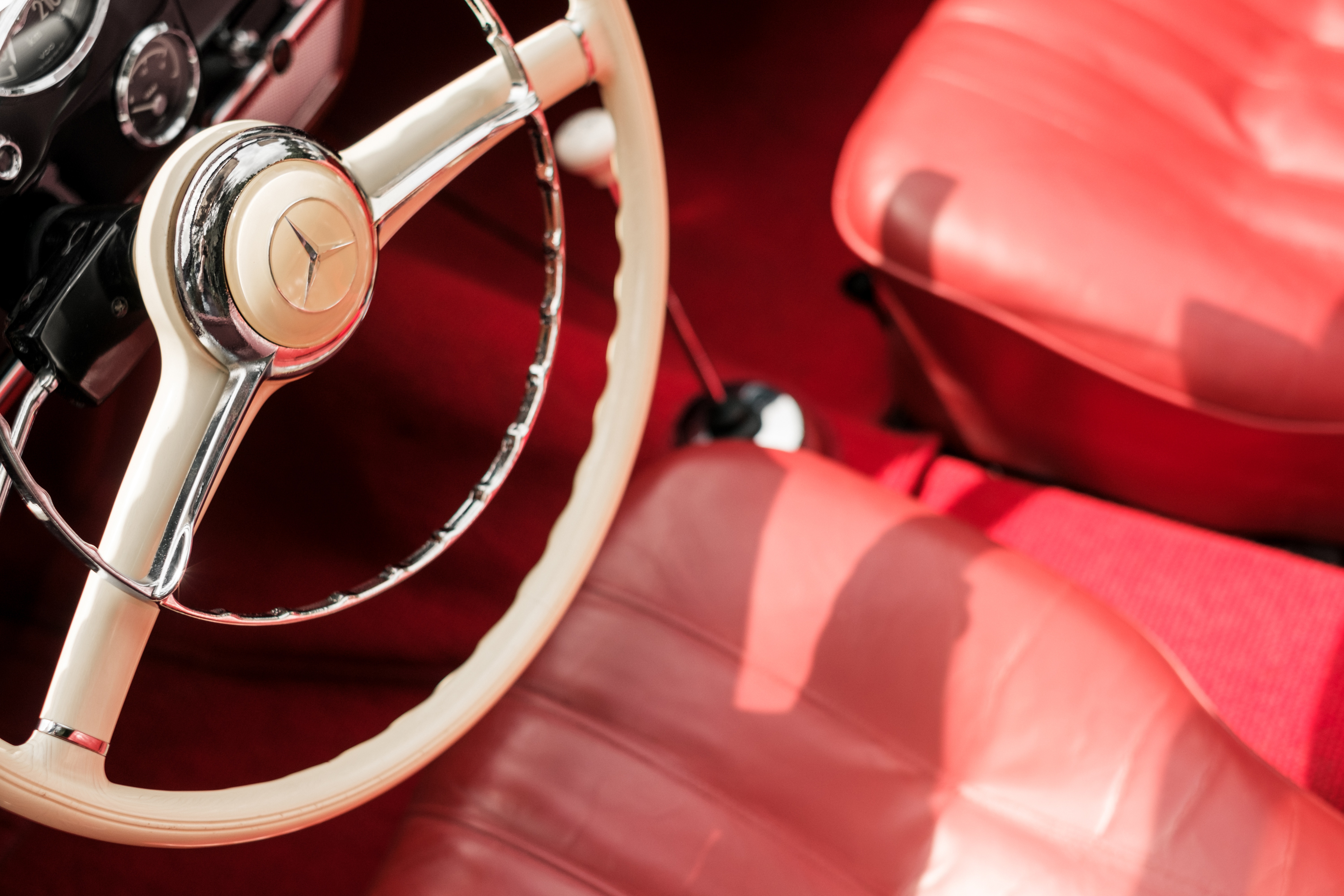 Mercedes vintage car interior with red seats and steering wheel HD Wallpaper