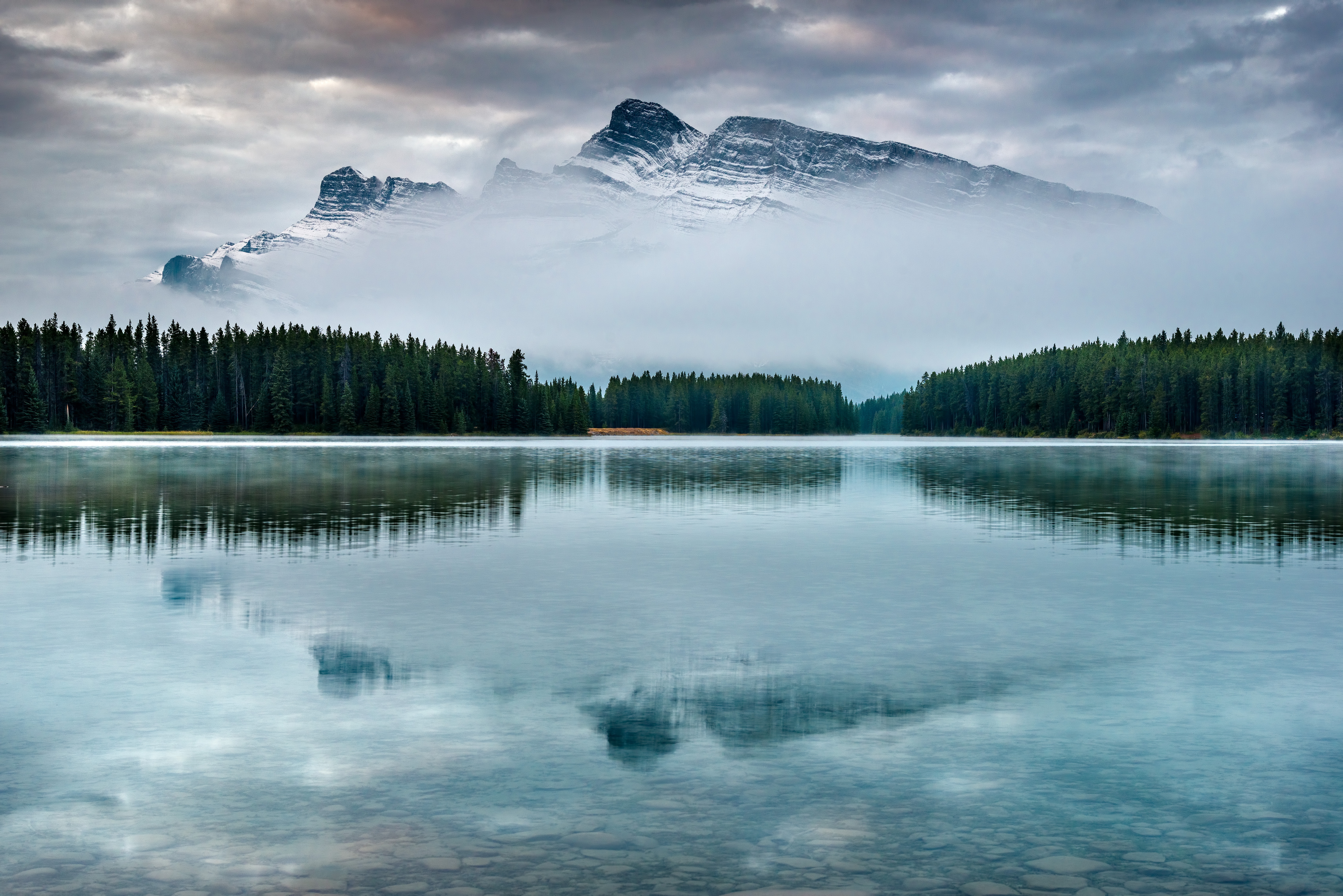 Misty Mountain Reflection on Lake Minnewanka HD Wallpaper