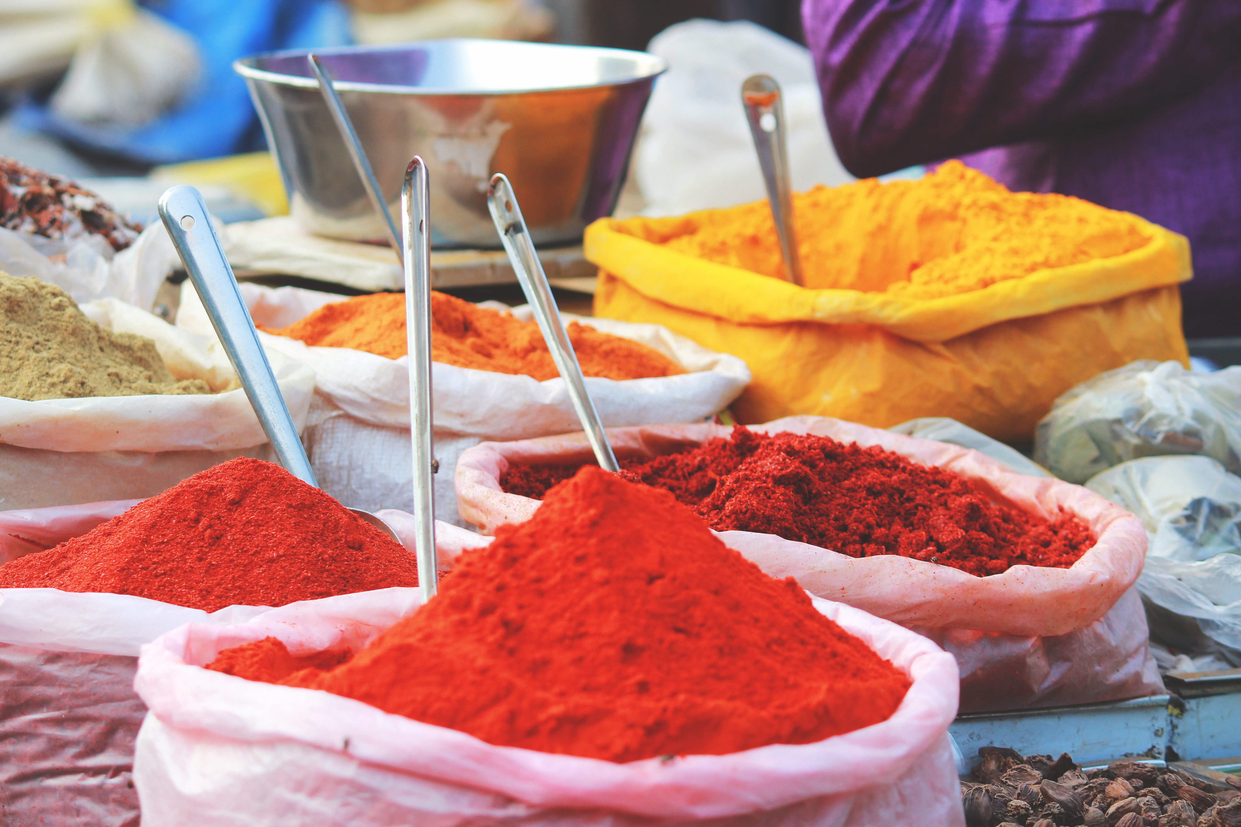 Spices in bags at an Indian market stall HD Wallpaper