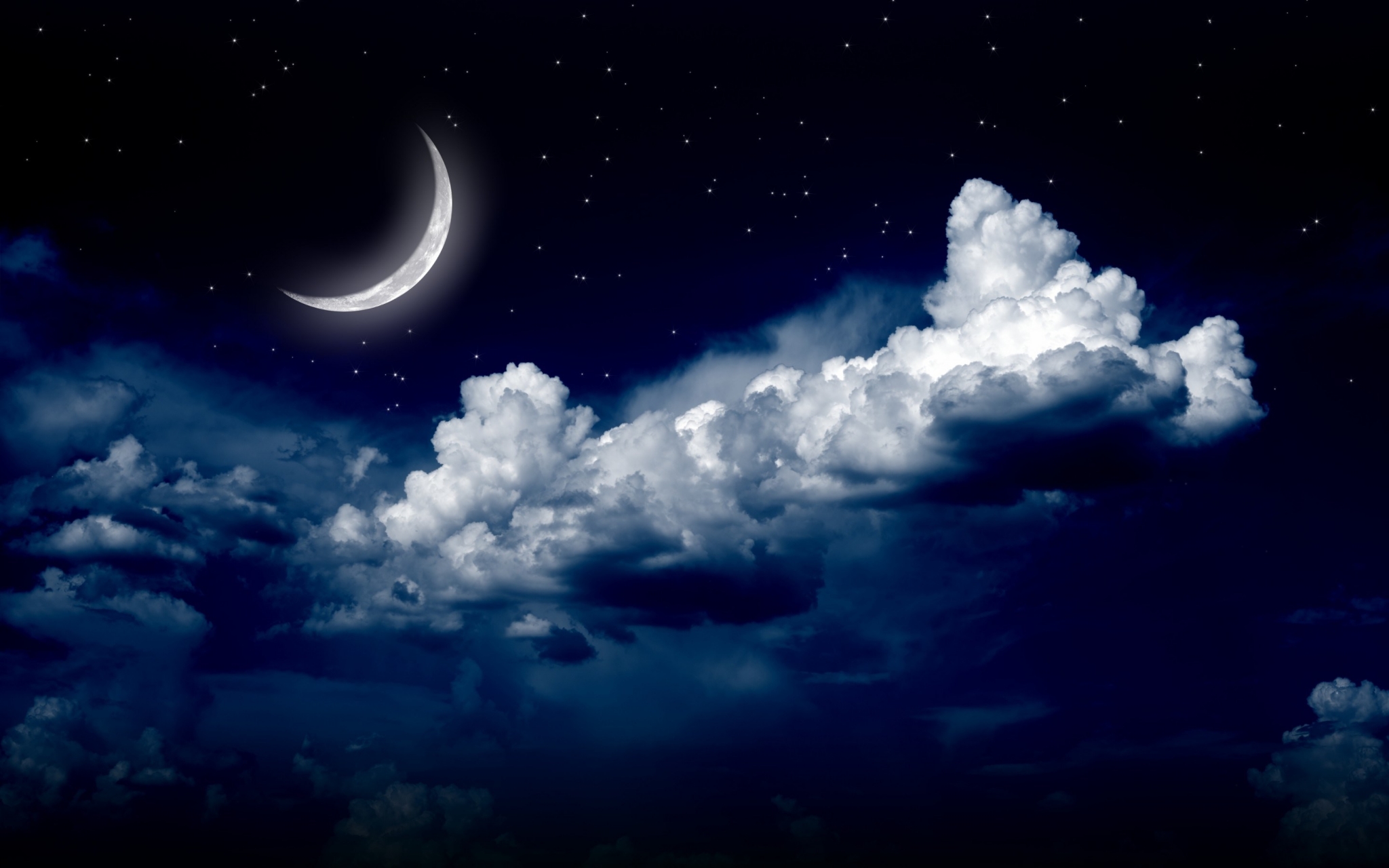 Crescent moon in a starry night sky with clouds HD Wallpaper