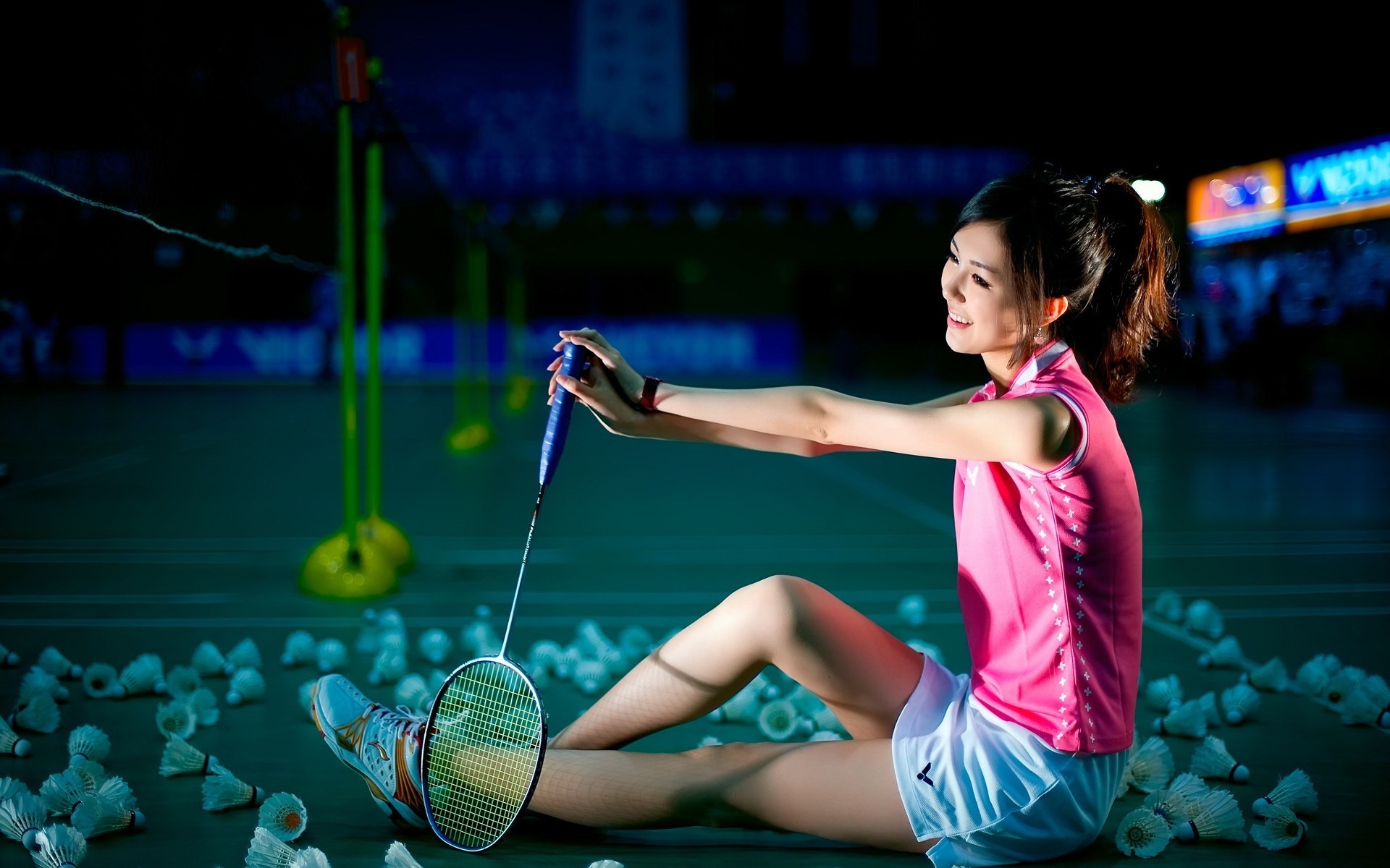 Young woman in pink sportswear with badminton racket HD Wallpaper