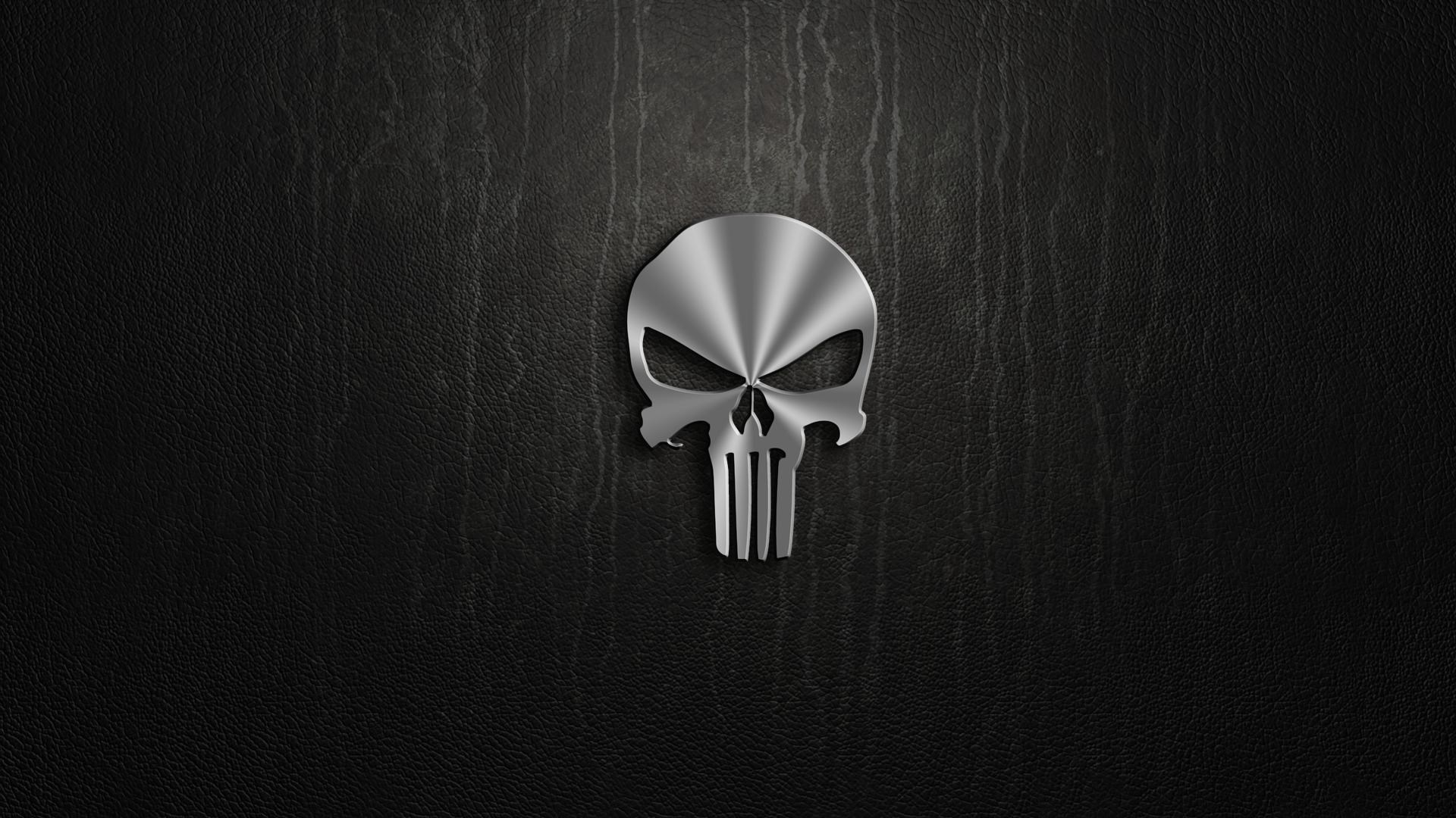 Punisher Skull Logo on Black Textured Surface HD Wallpaper