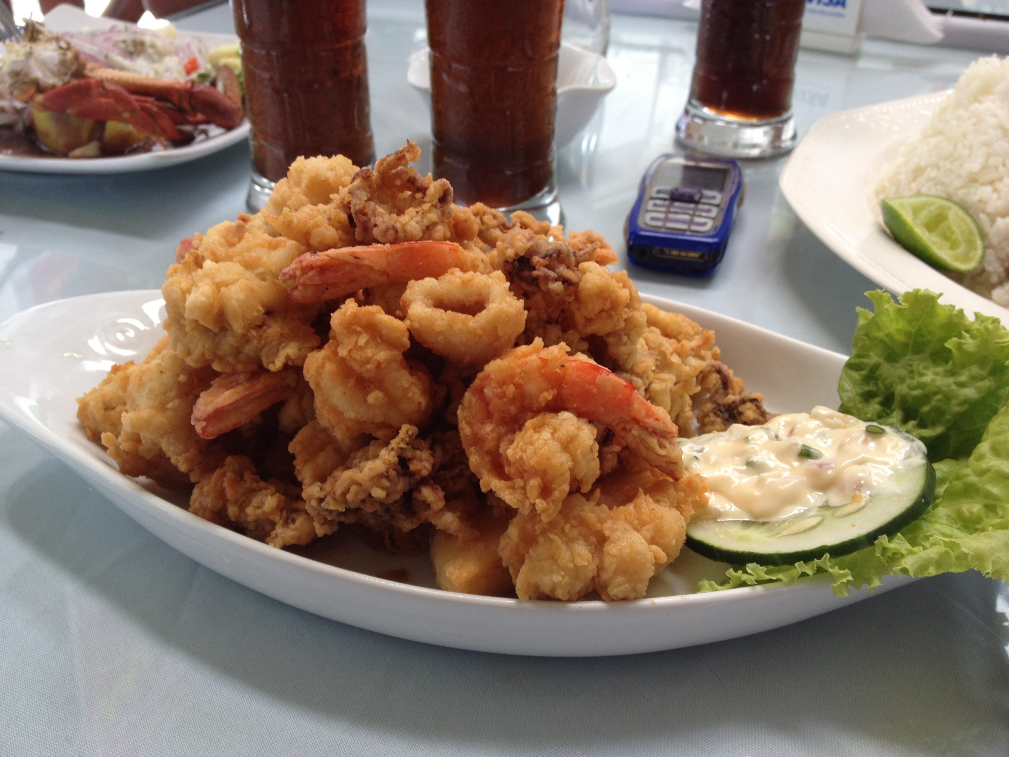Fried seafood platter with dipping sauce and rice HD Wallpaper