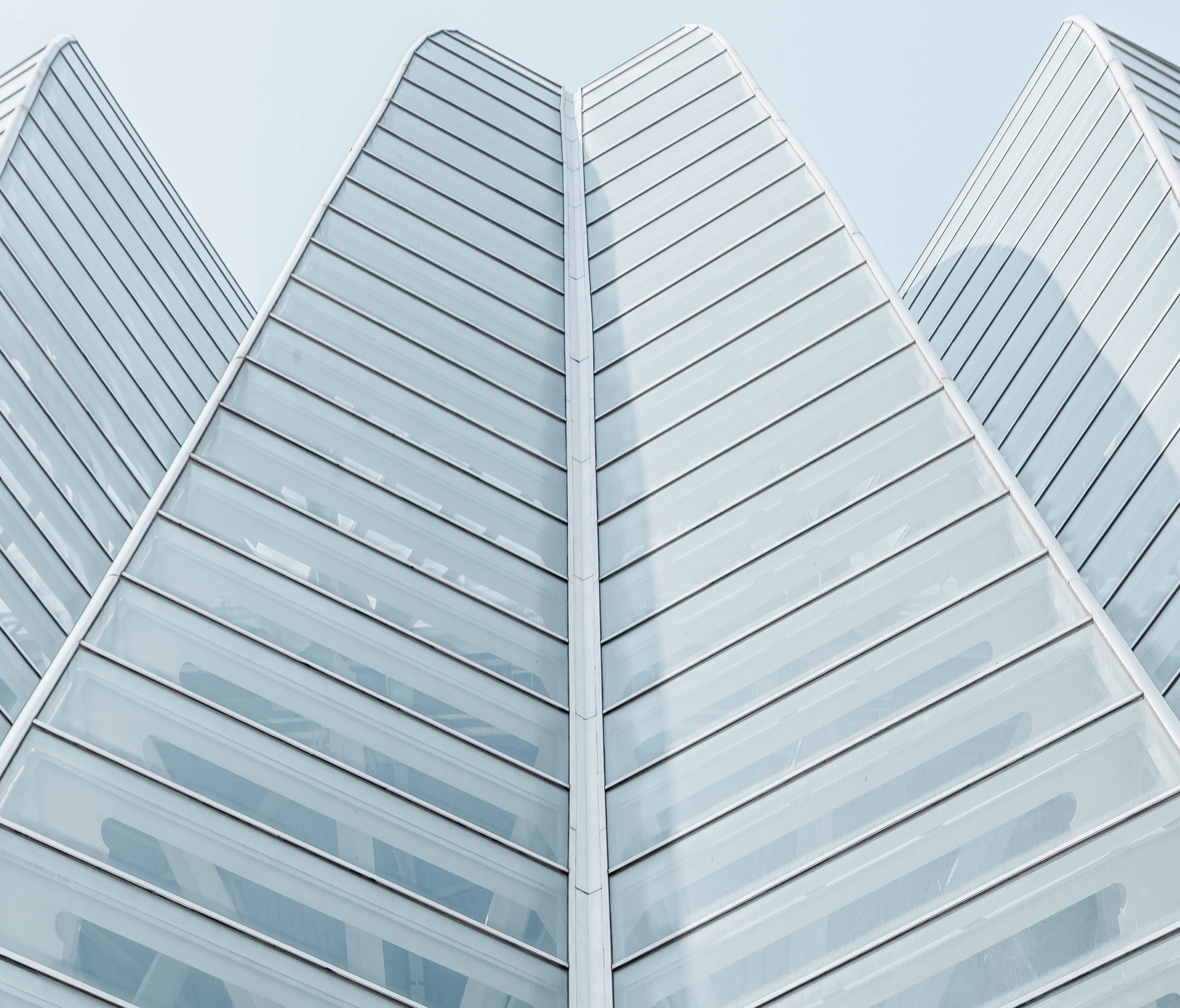 Geometric modern architecture with glass facade HD Wallpaper