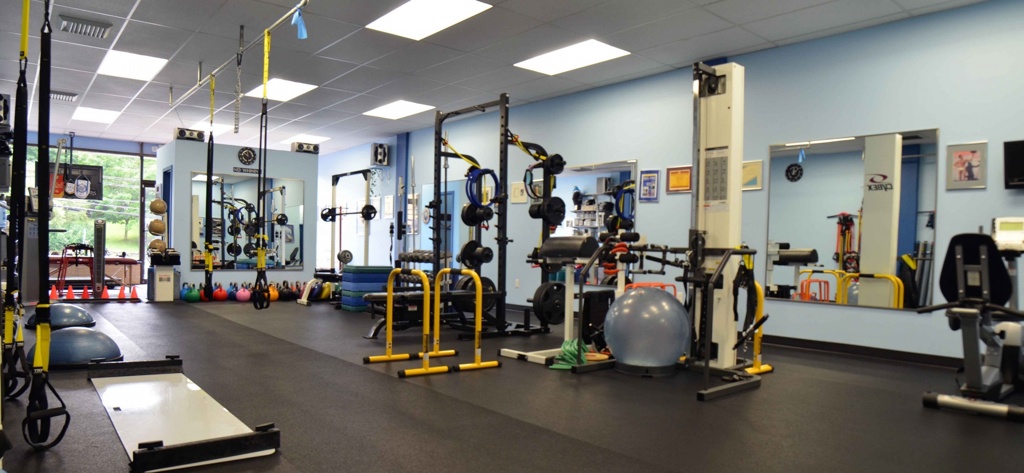 Gym with exercise equipment and weights HD Wallpaper