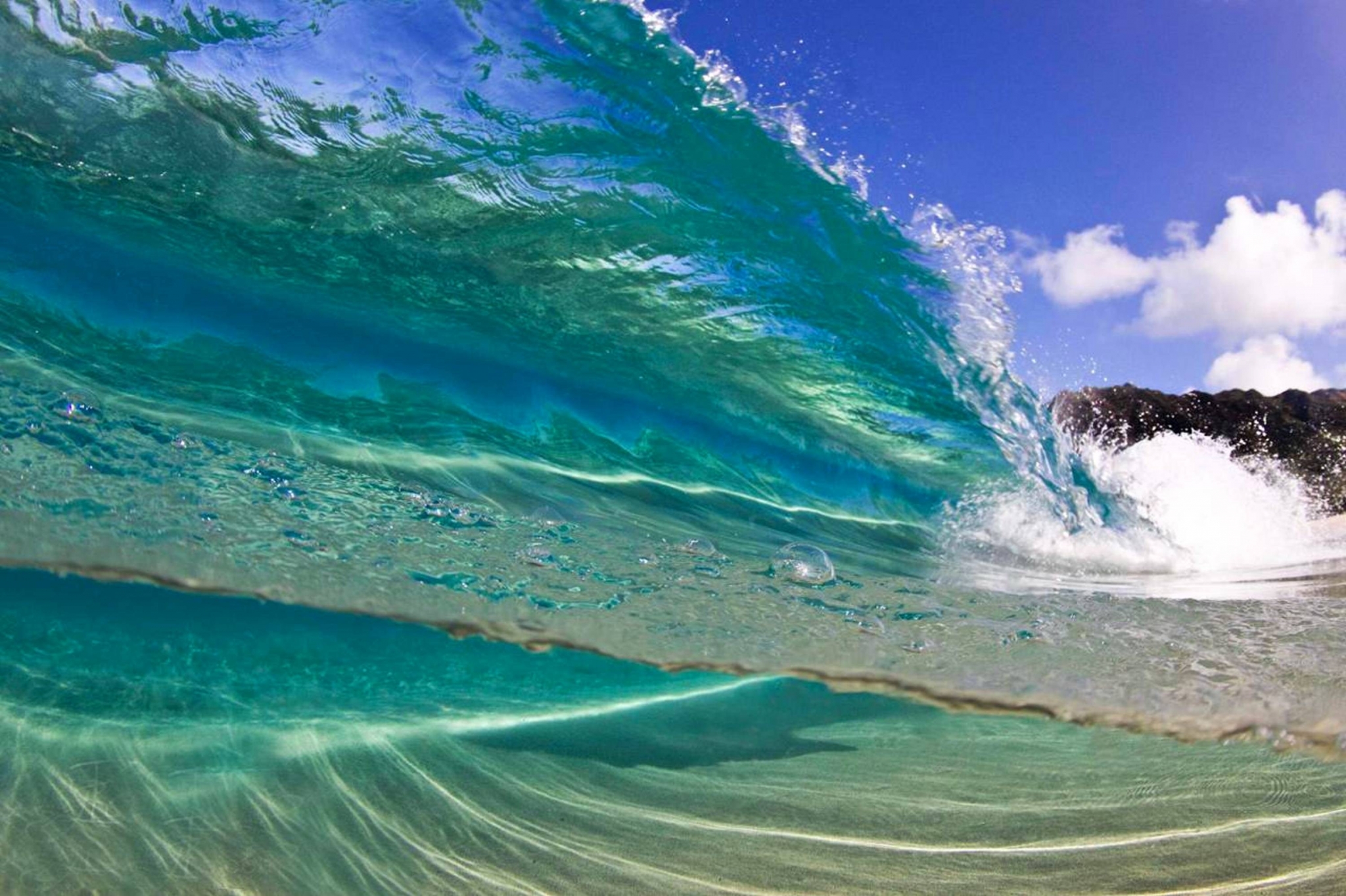 Underwater wave breaking on sandy beach HD Wallpaper