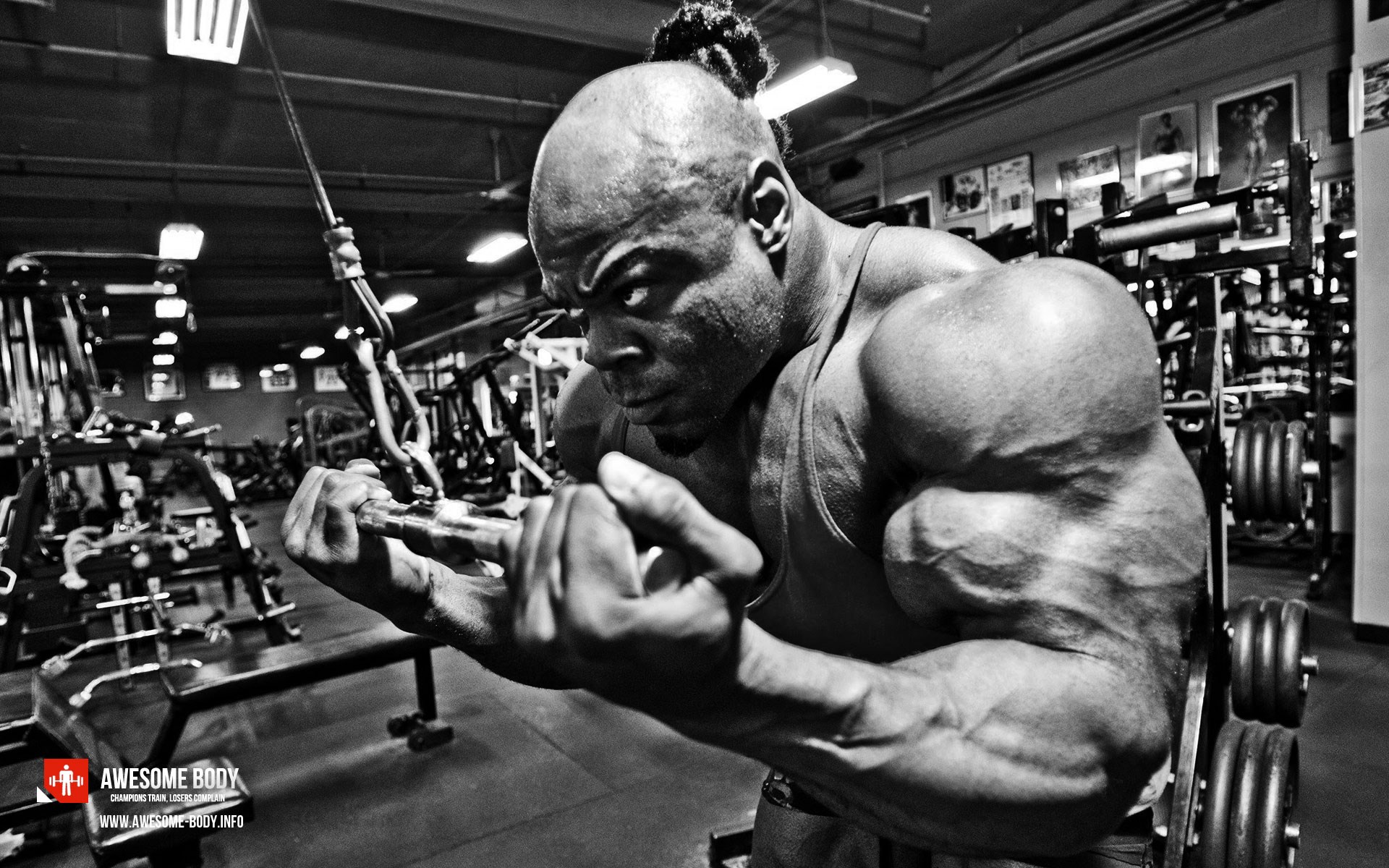 Kai Greene flexing in a gym HD Wallpaper