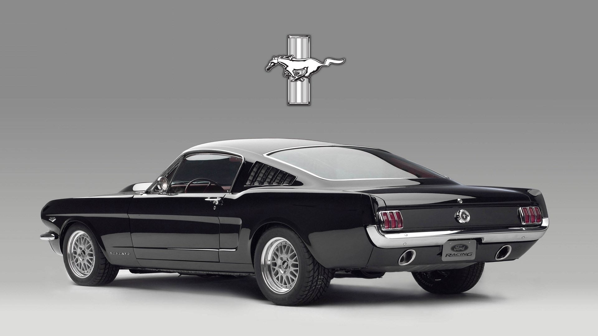 Black 1965 Ford Mustang Fastback with Ford Racing logo HD Wallpaper