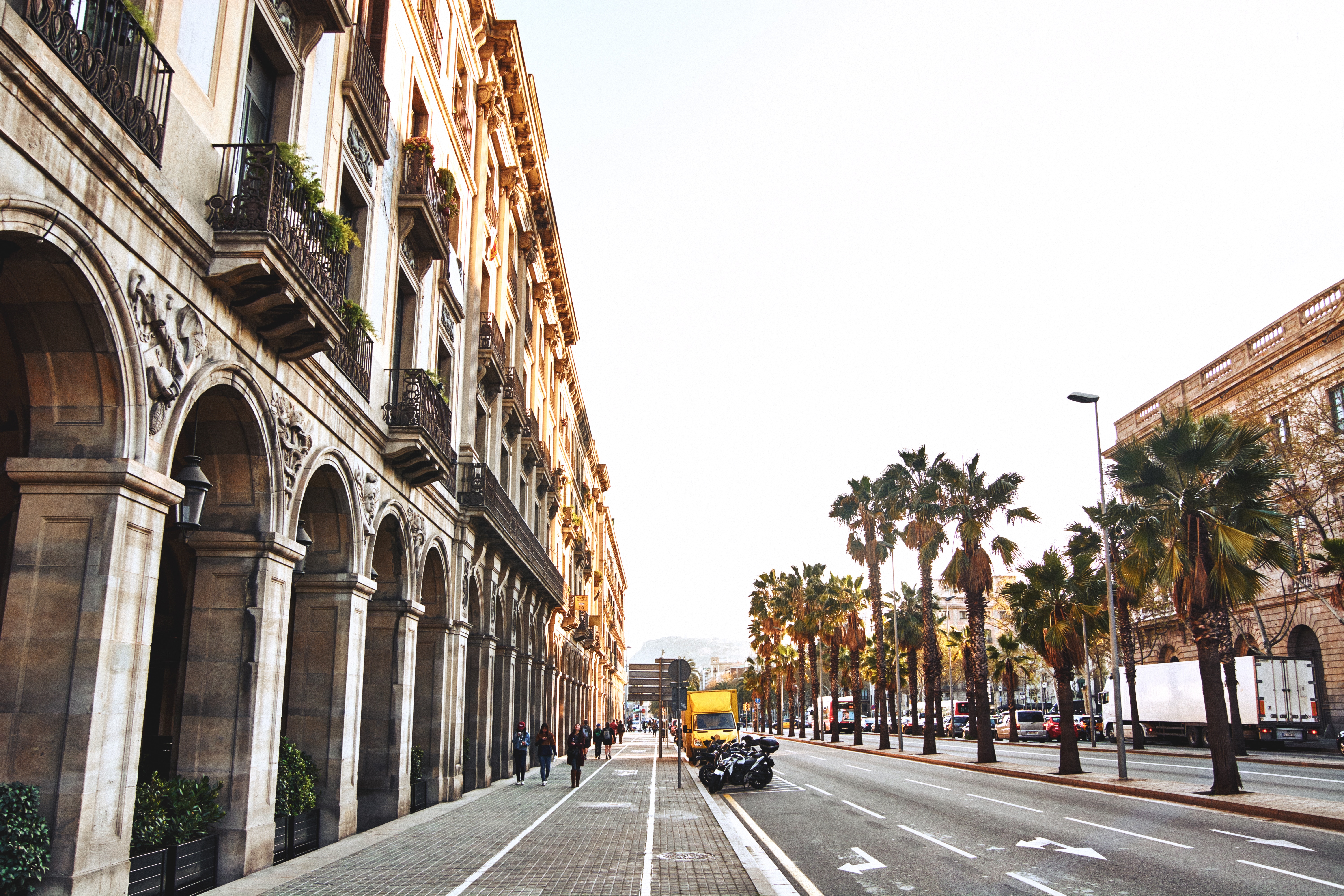 Street with Arches, Balconies, and Palm Trees HD Wallpaper