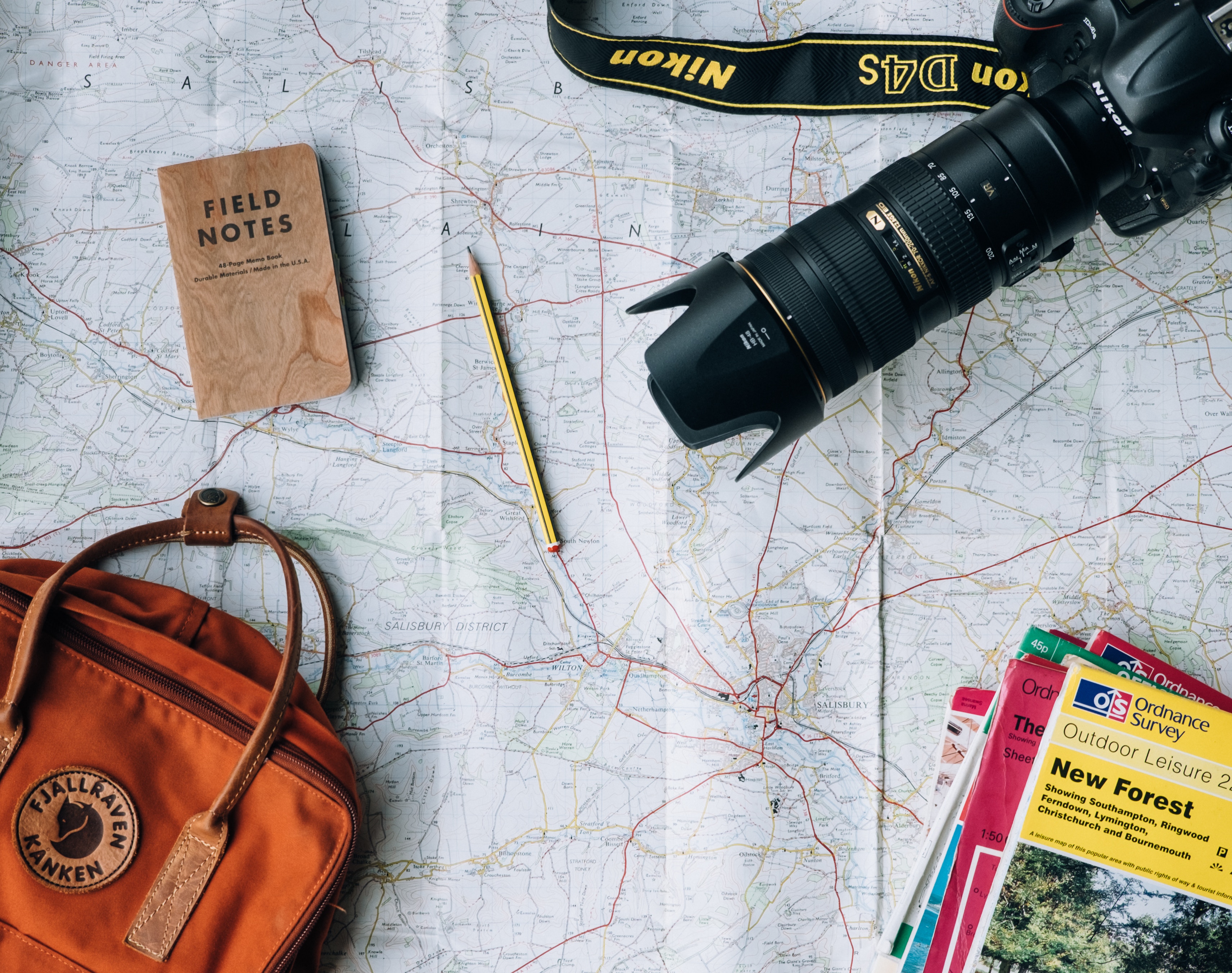 Nikon Camera and Map for Outdoor Adventure HD Wallpaper