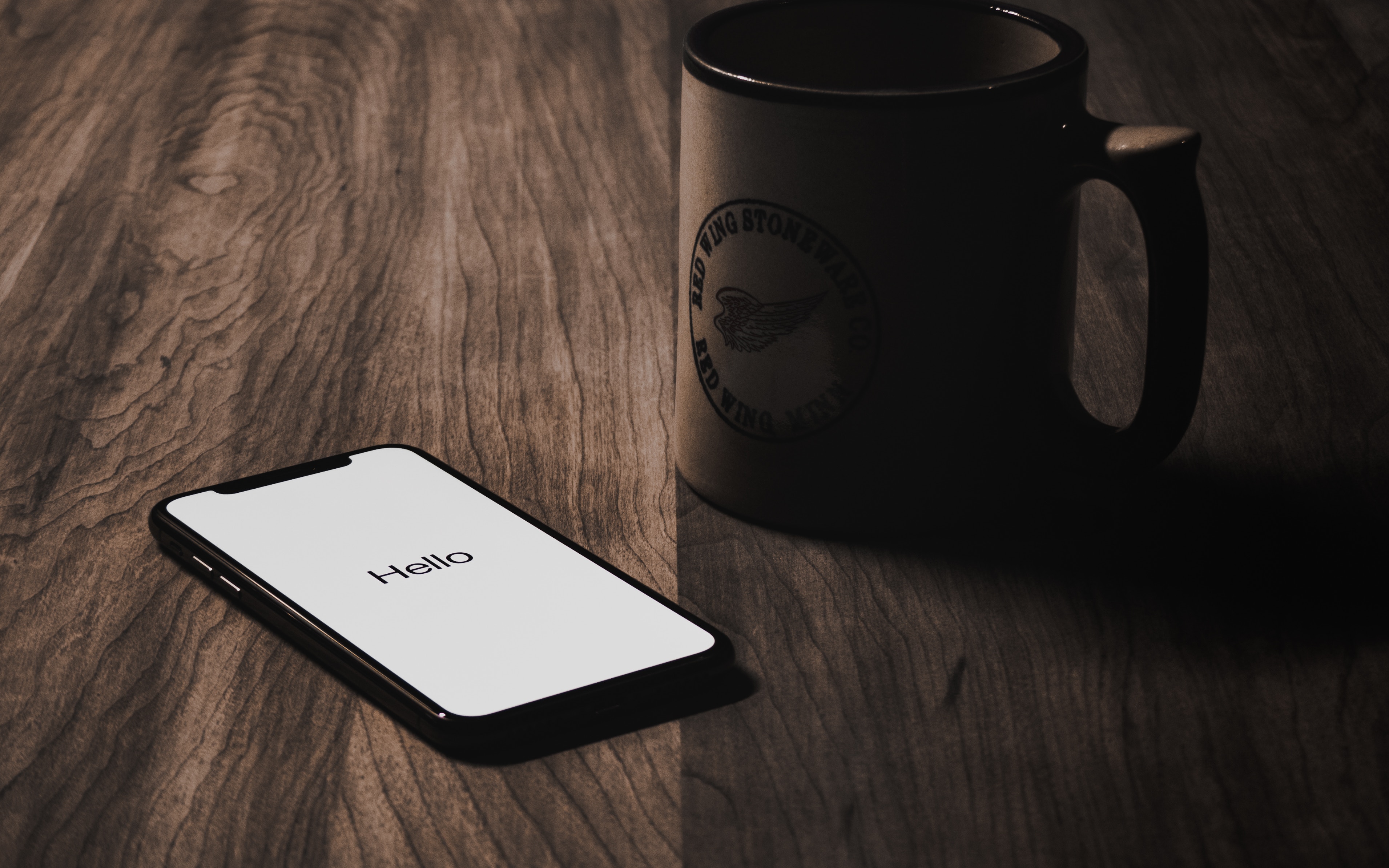 iPhone X and Red Wing Stoneware Mug on Wooden Table HD Wallpaper