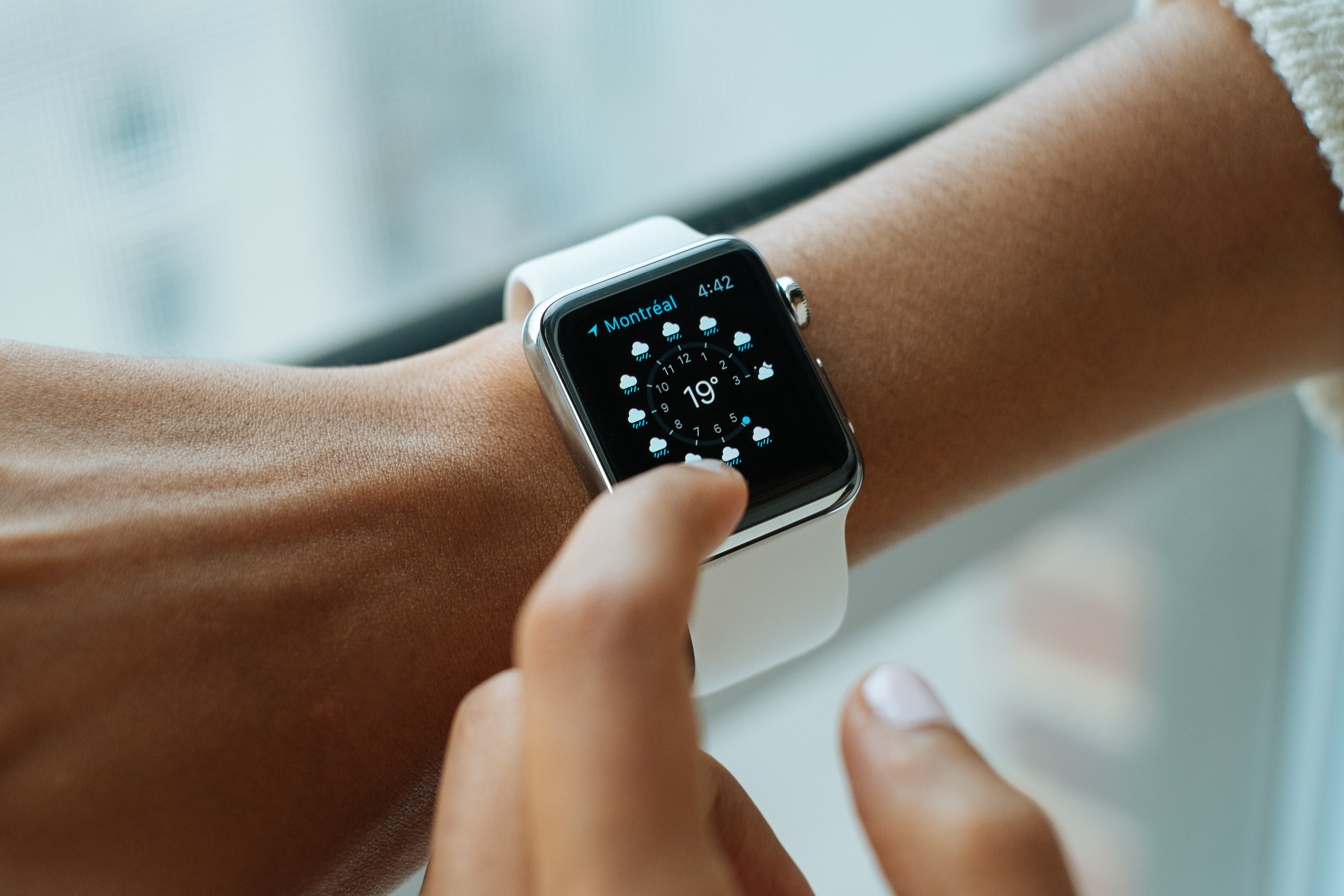 Person checking Apple Watch weather in Montreal HD Wallpaper