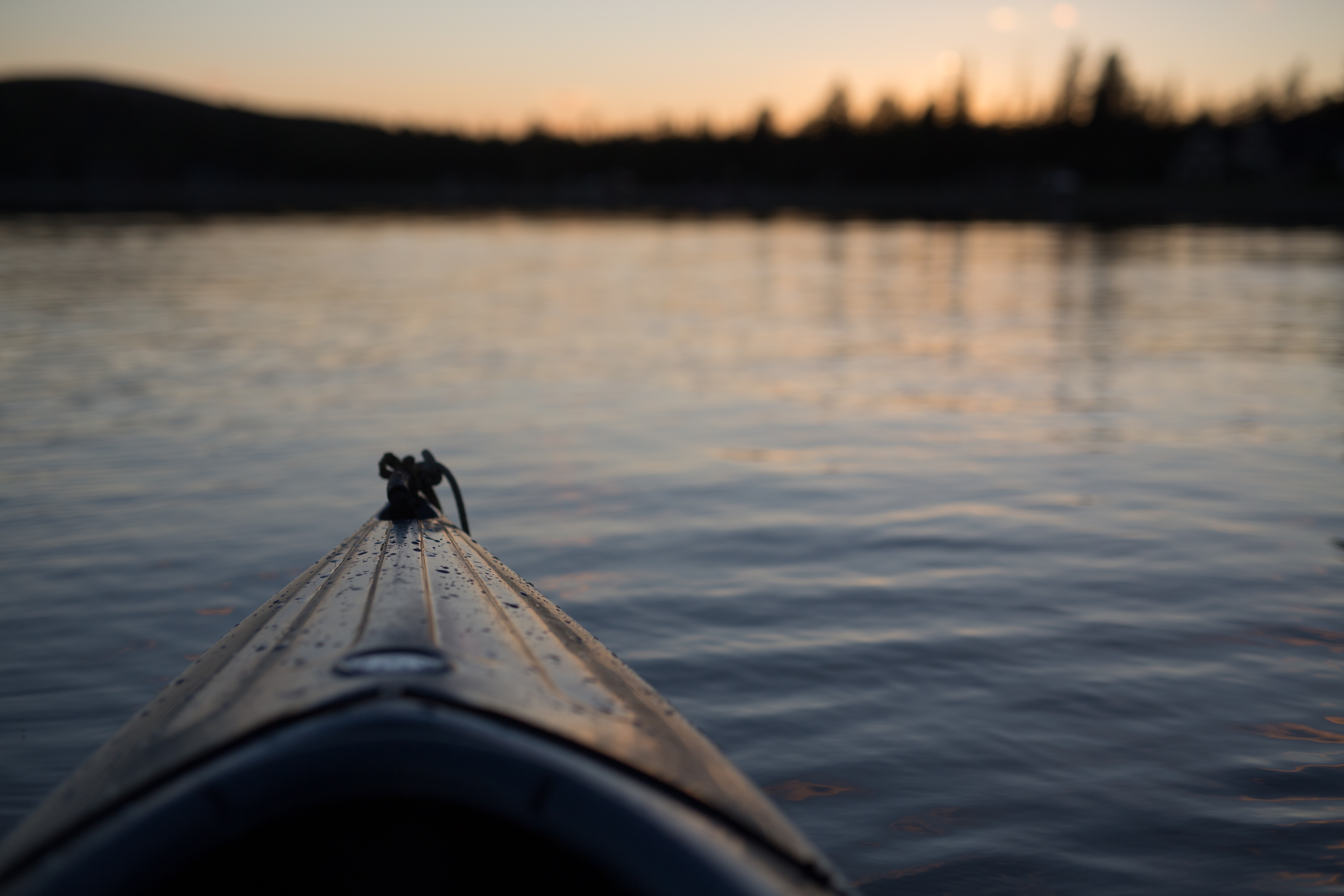 Kayak on a lake at sunset HD Wallpaper