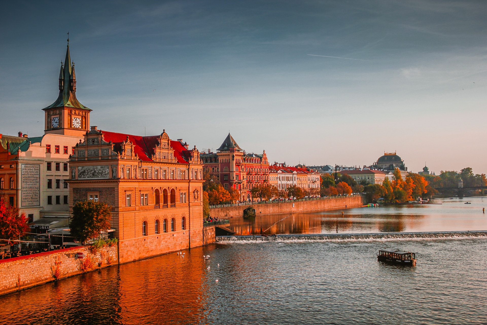 Prague Old Town buildings along the Vltava River at sunset HD Wallpaper