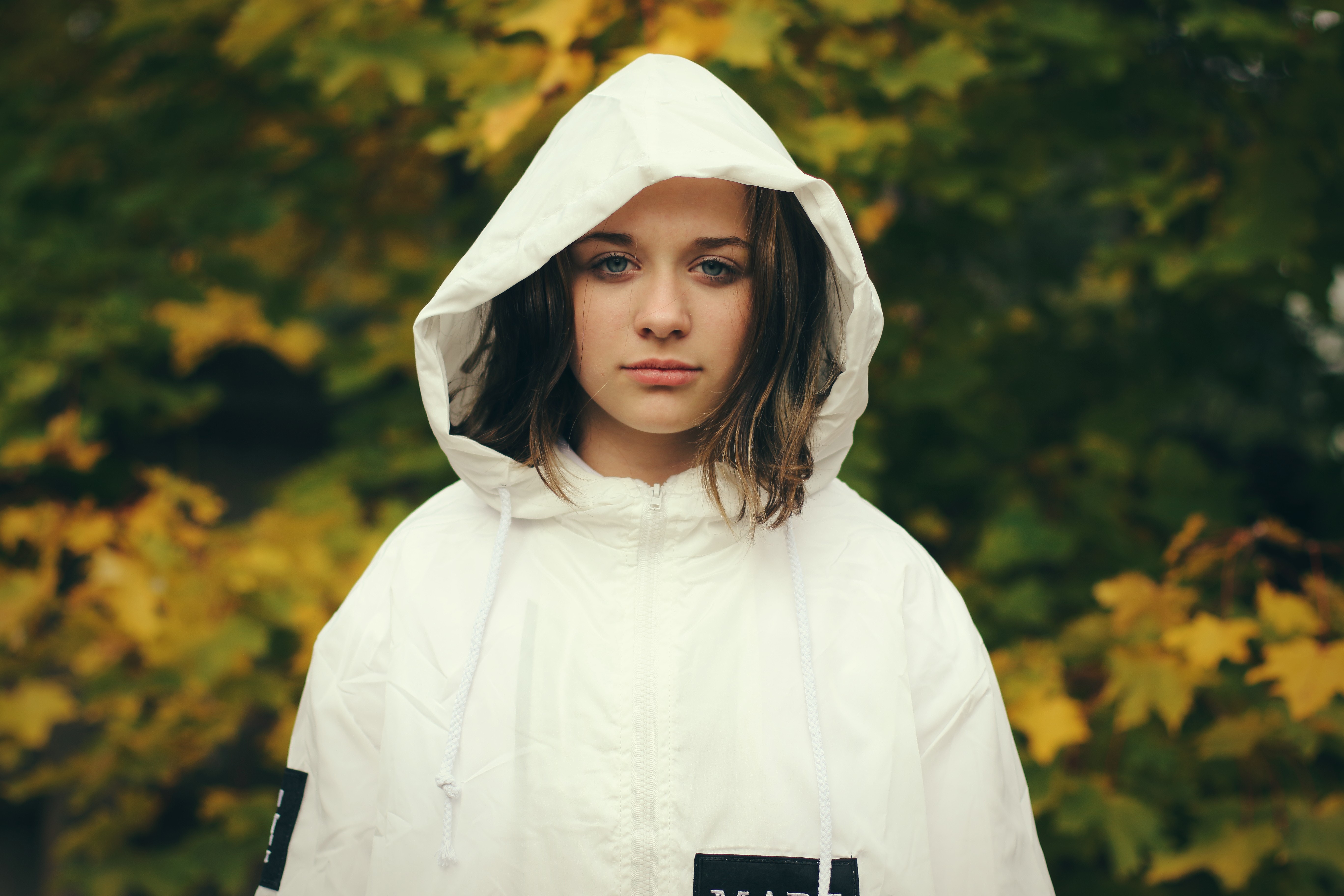 Young woman in a white hooded jacket in autumn HD Wallpaper