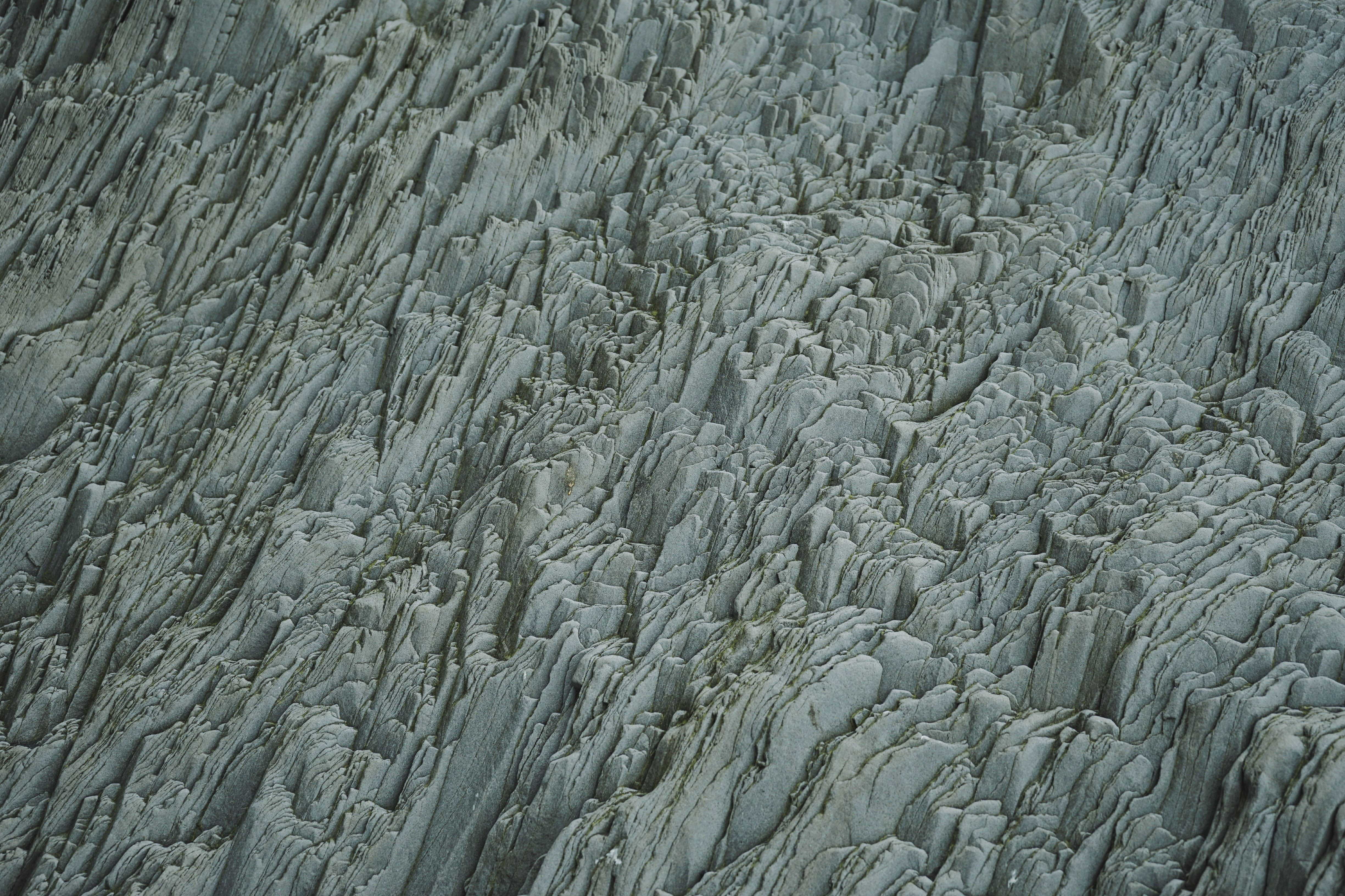Geological rock formations on a black beach in Iceland HD Wallpaper