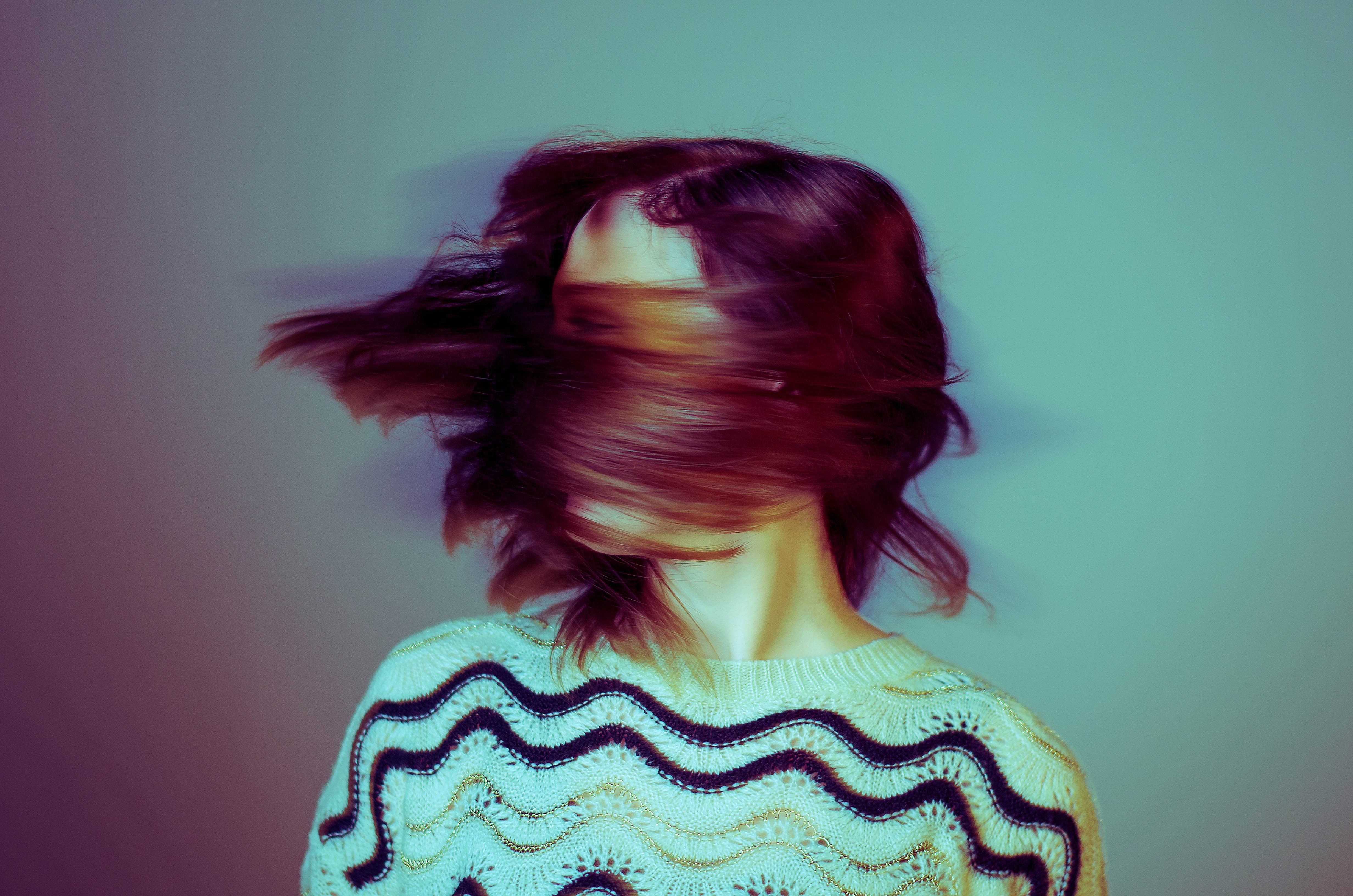Woman with hair blurred by motion HD Wallpaper