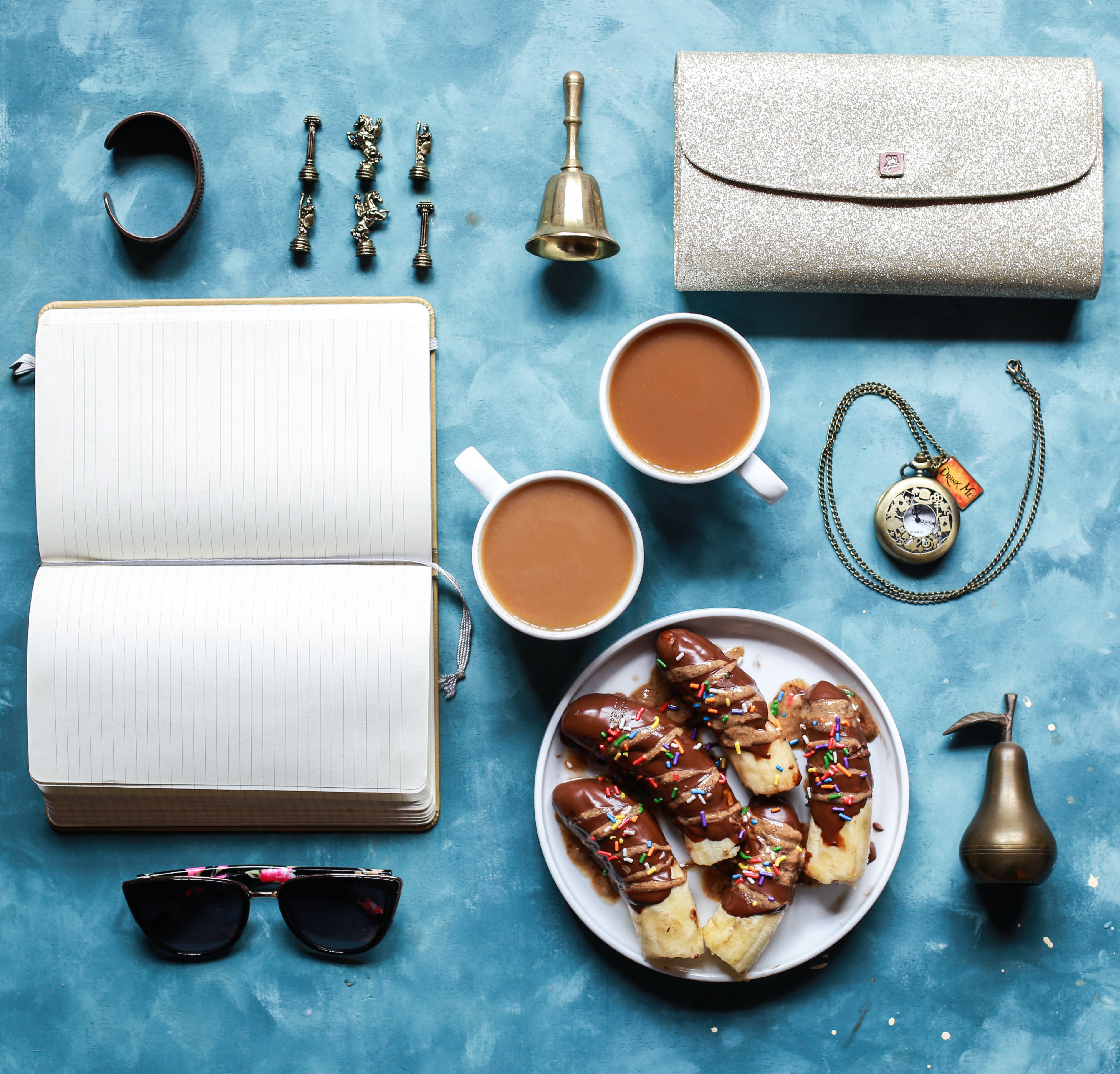Chocolate-covered bananas with coffee and accessories HD Wallpaper
