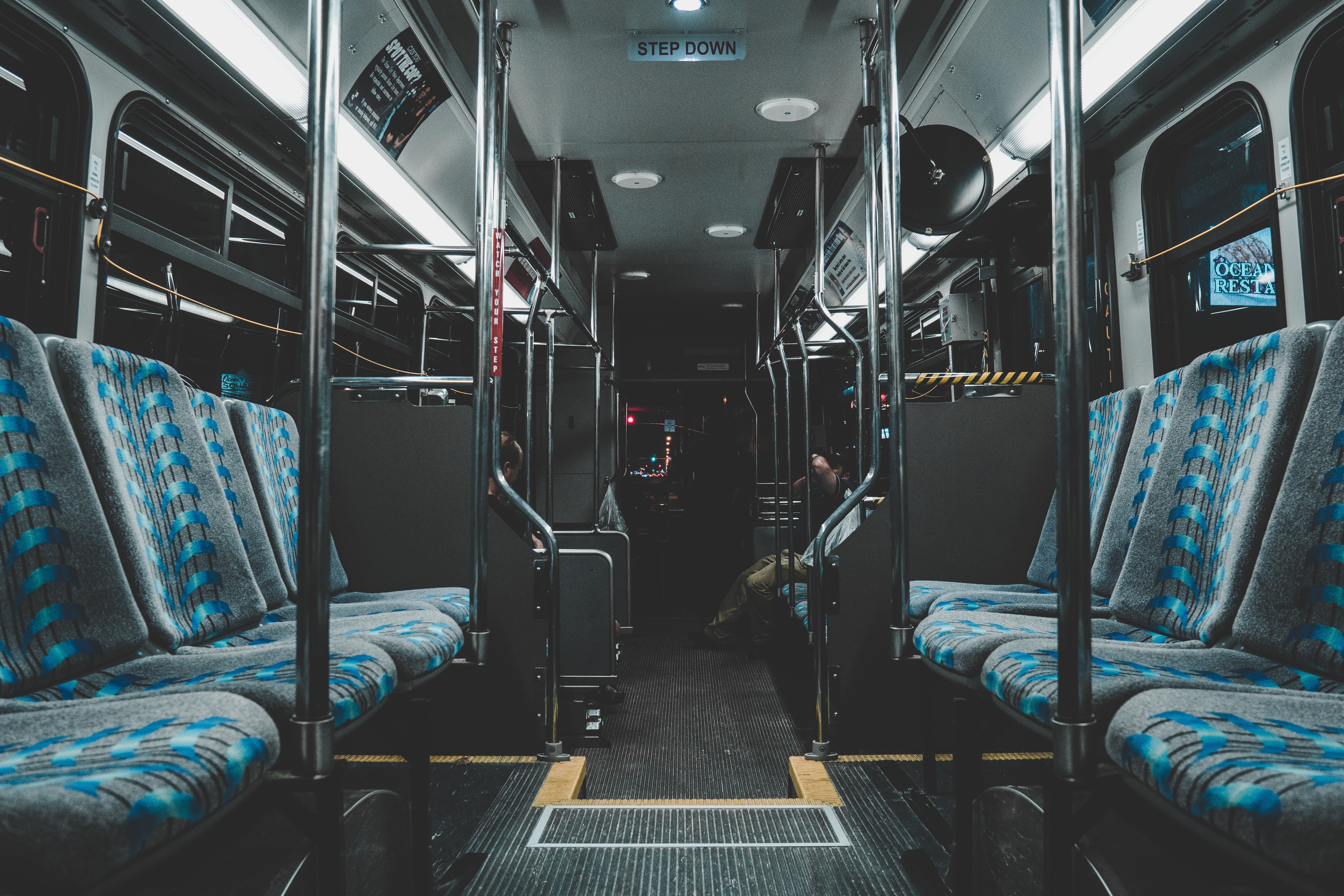 Interior of a bus with blue seats HD Wallpaper
