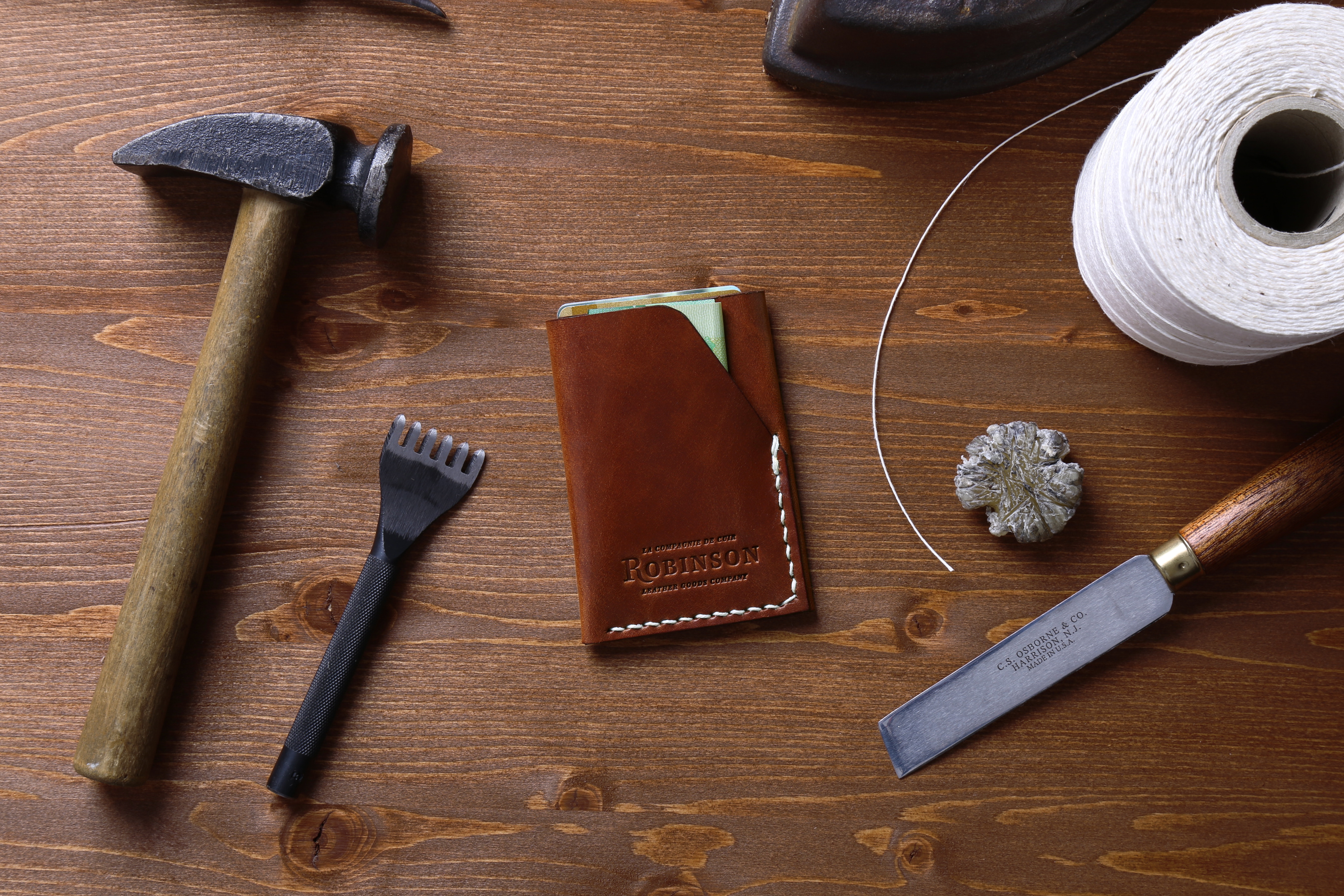 Robinson handmade leather wallet with crafting tools HD Wallpaper