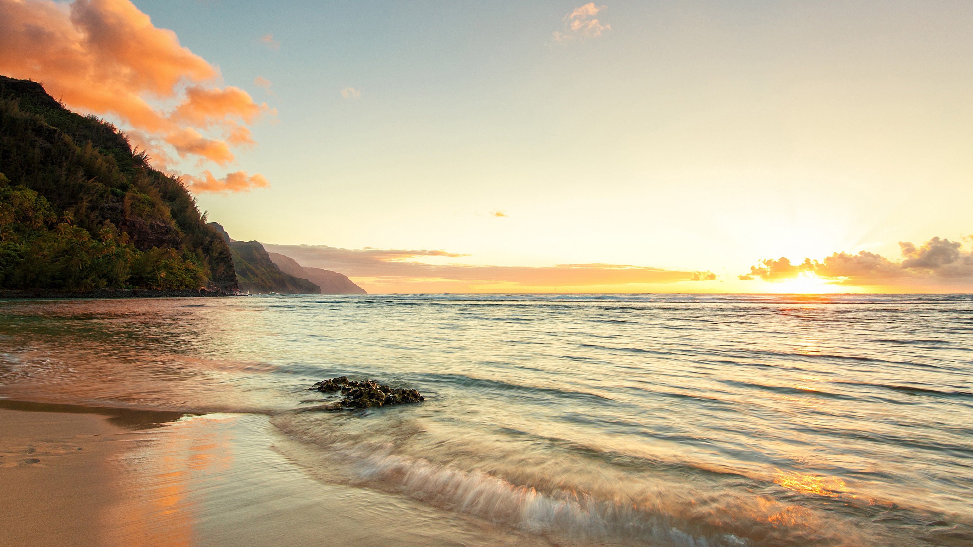 Sunset over a tropical beach with mountains HD Wallpaper