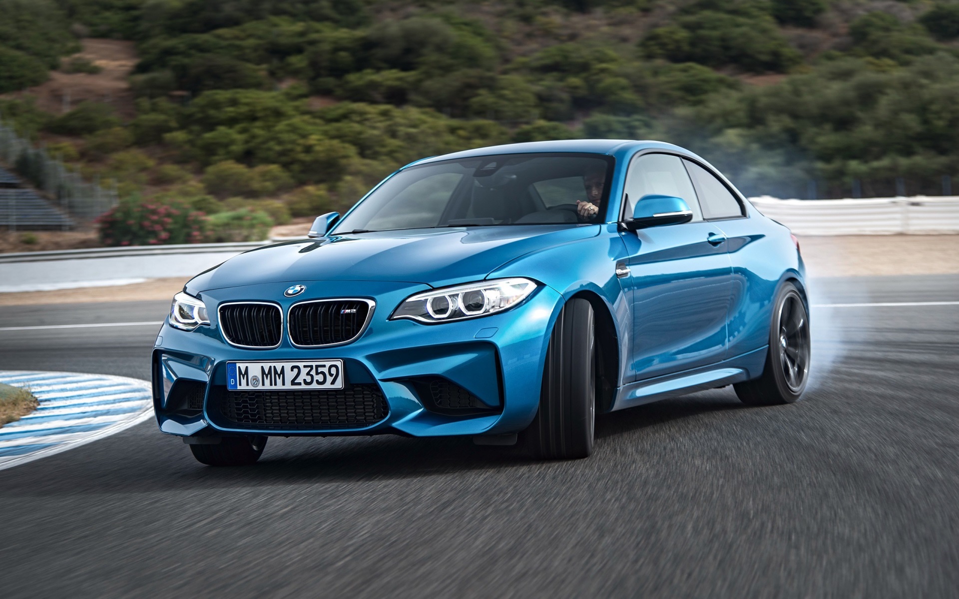 Blue BMW M2 Drifting on a Race Track HD Wallpaper