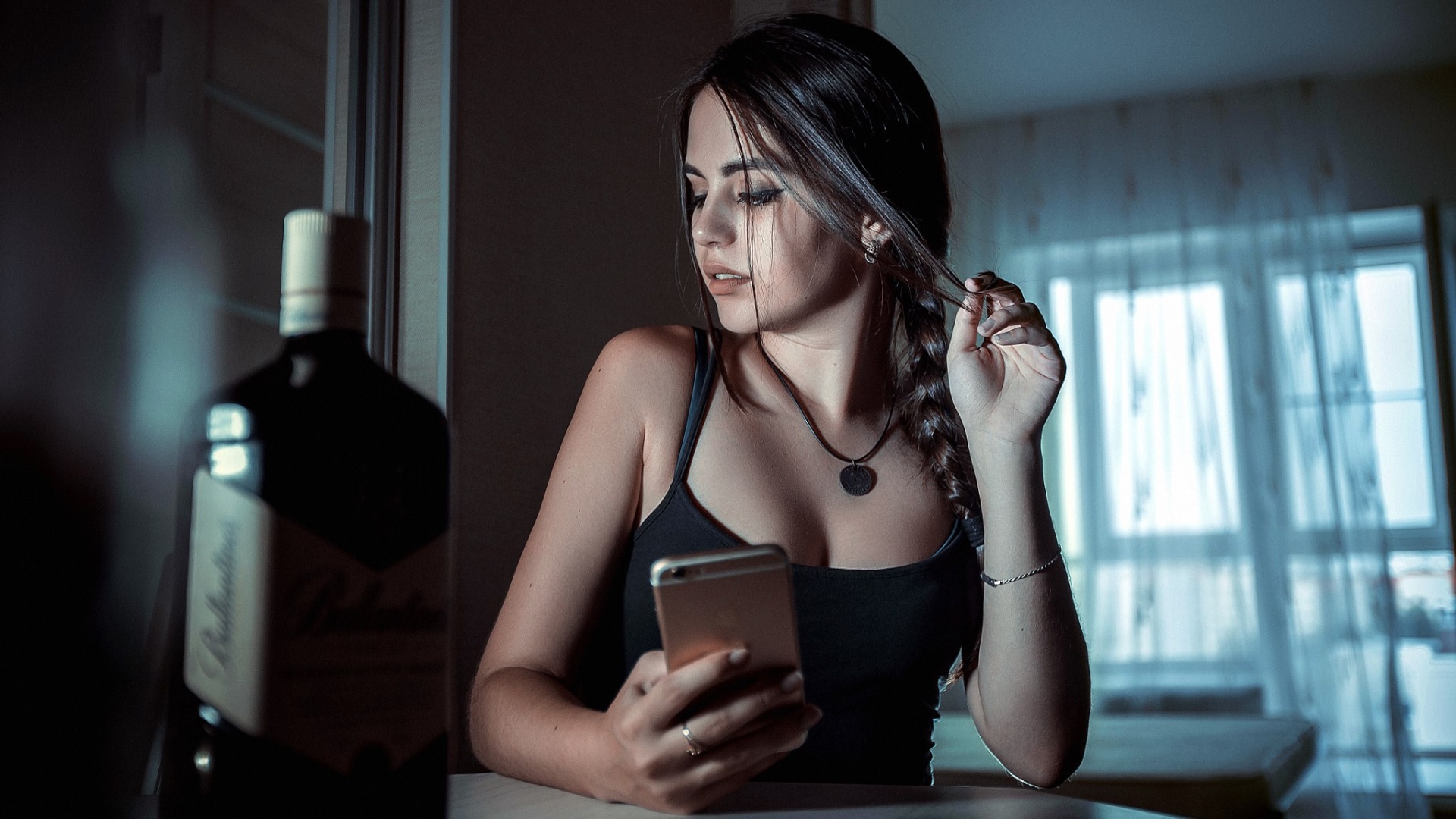 Young Woman in Thought Holding Smartphone HD Wallpaper