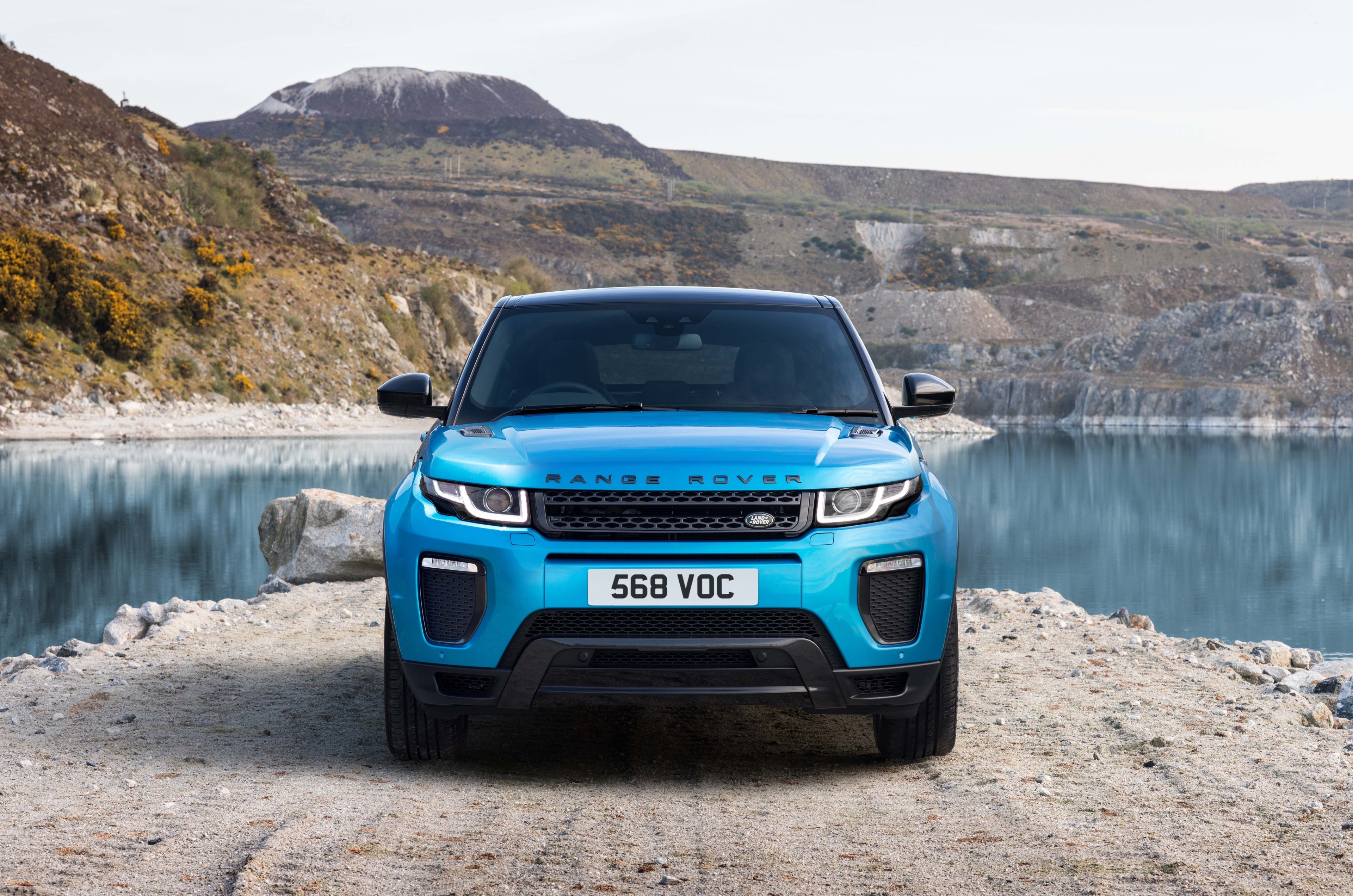 Blue Range Rover Evoque by a lake HD Wallpaper