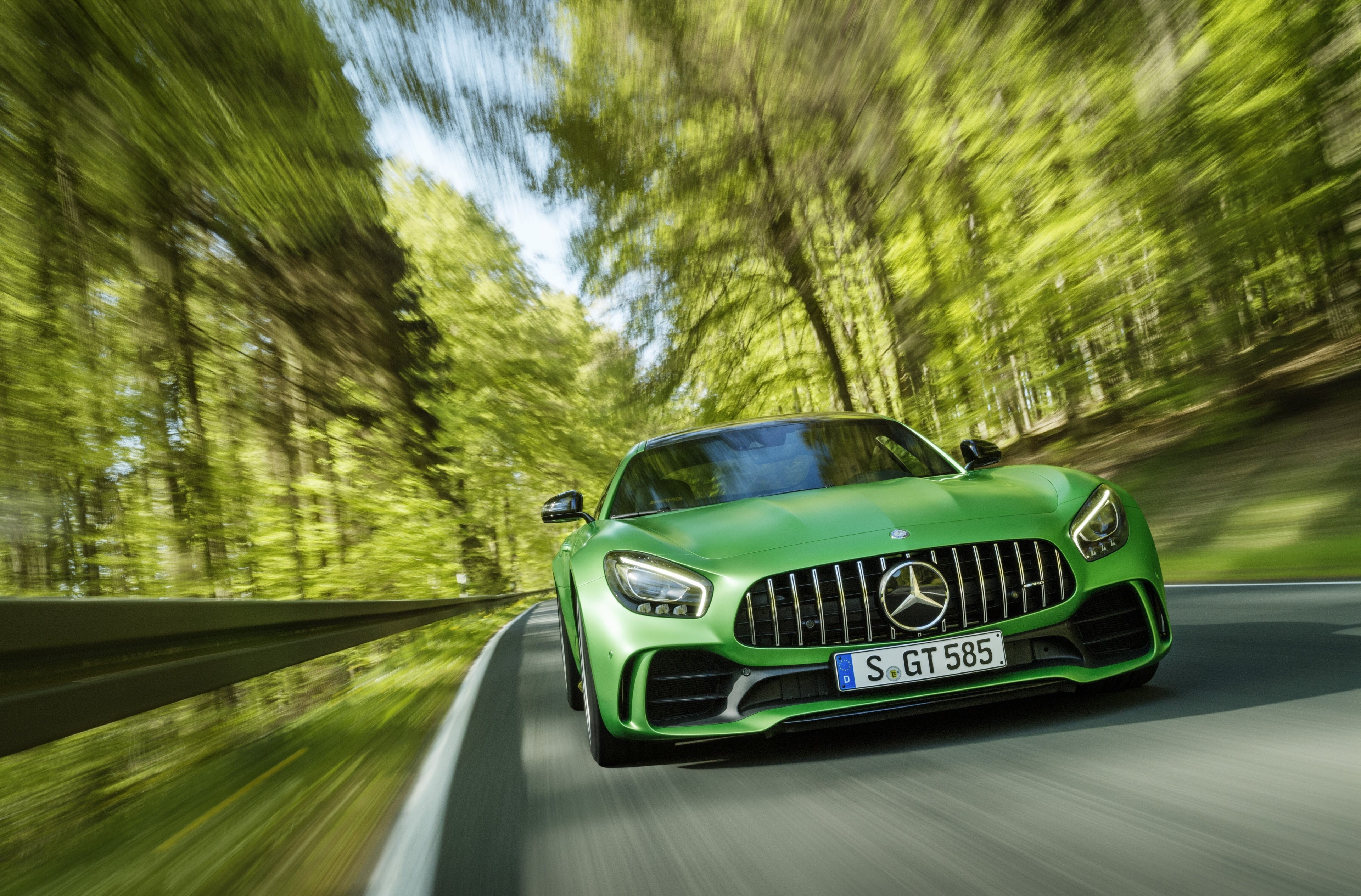 Green Mercedes-AMG GT R driving on a forest road HD Wallpaper