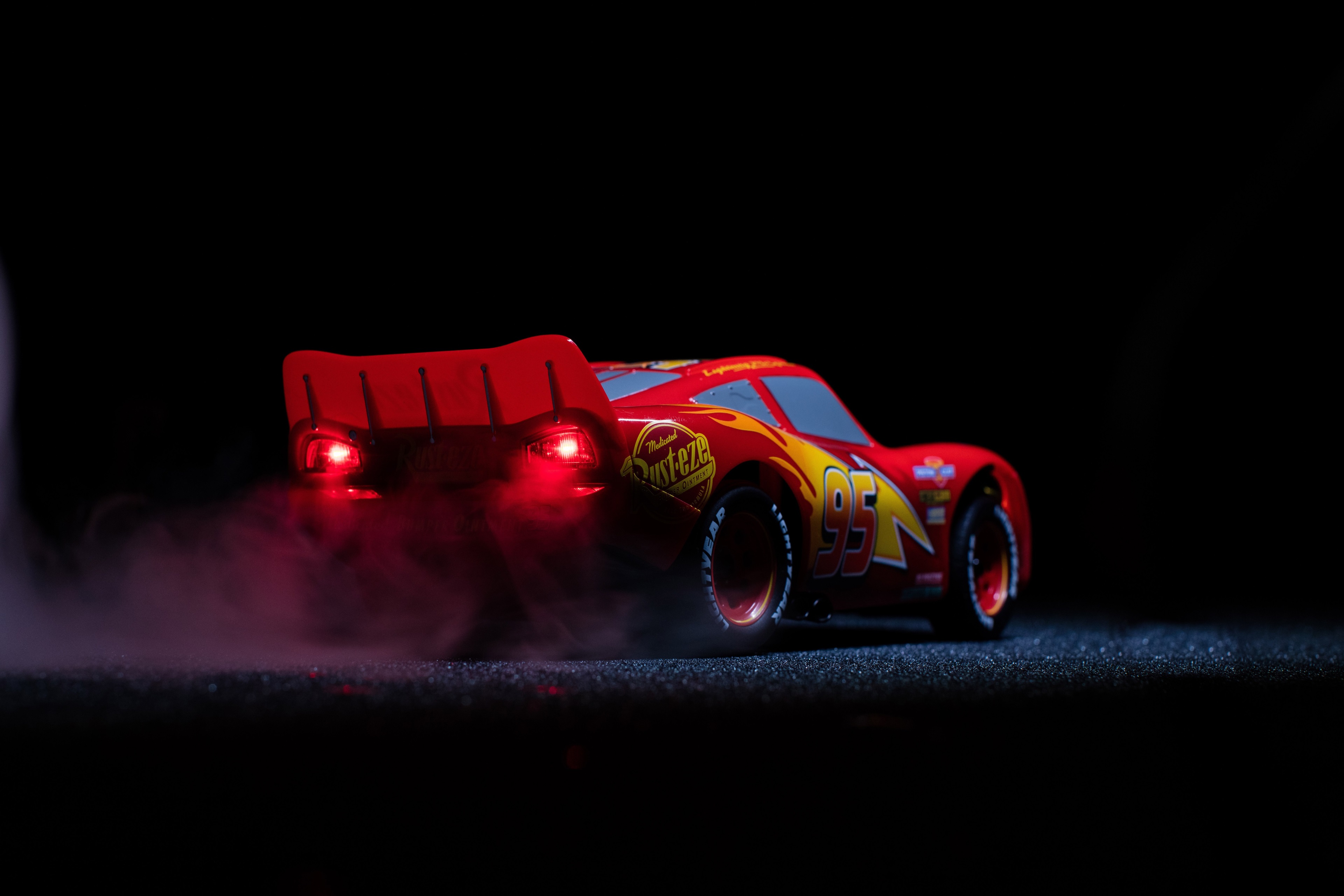 Lightning McQueen from Cars with smoke HD Wallpaper