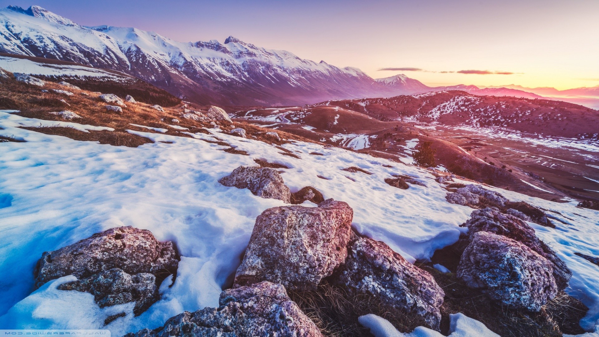 Snowy mountain landscape at sunset HD Wallpaper