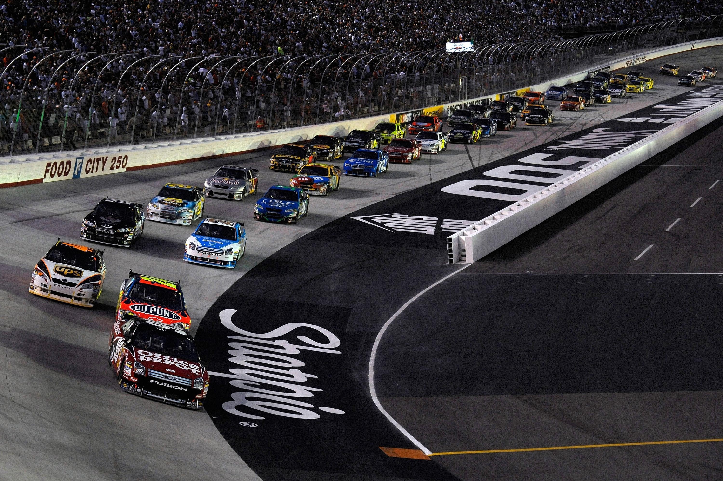 NASCAR race cars on track at night HD Wallpaper