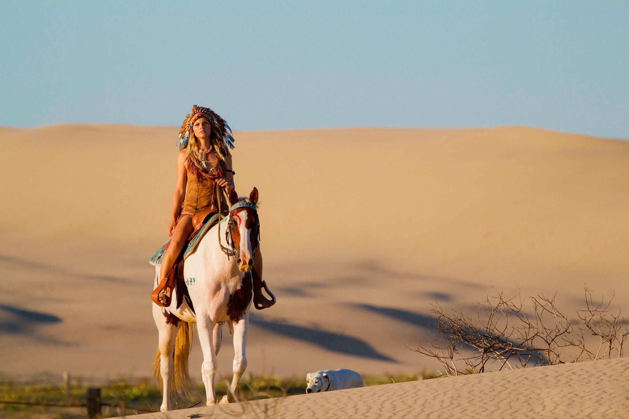 Woman in Native American Headdress Riding Horse in Desert HD Wallpaper