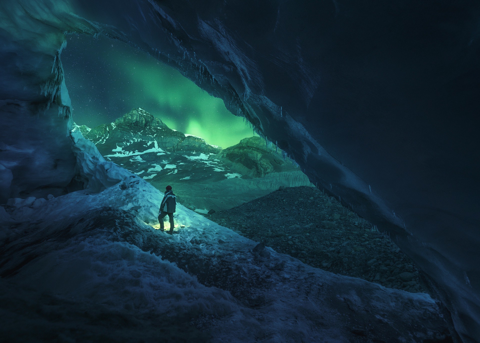 Man in Ice Cave with Aurora Borealis in Canada HD Wallpaper