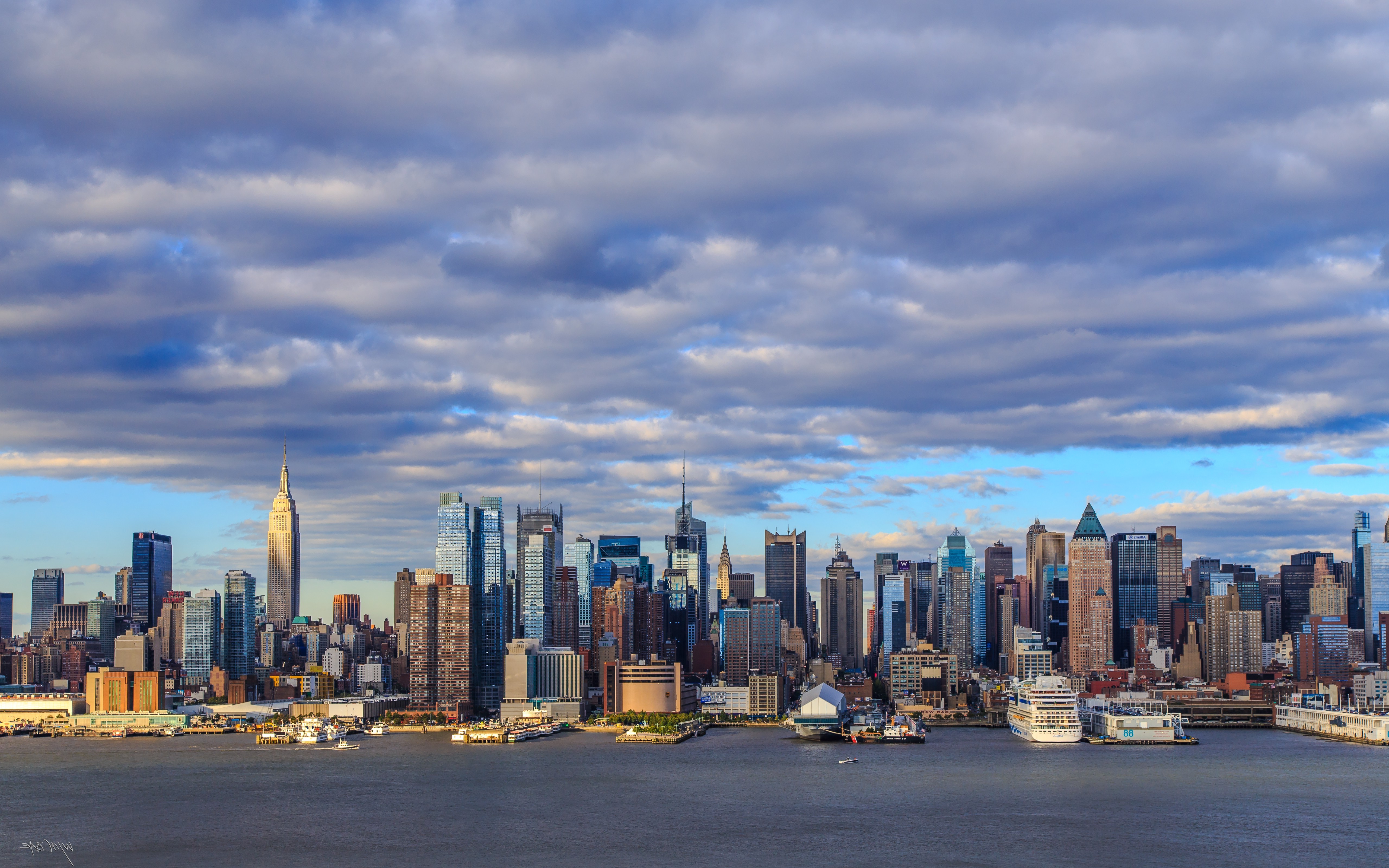 New York City Skyline with Dramatic Clouds HD Wallpaper