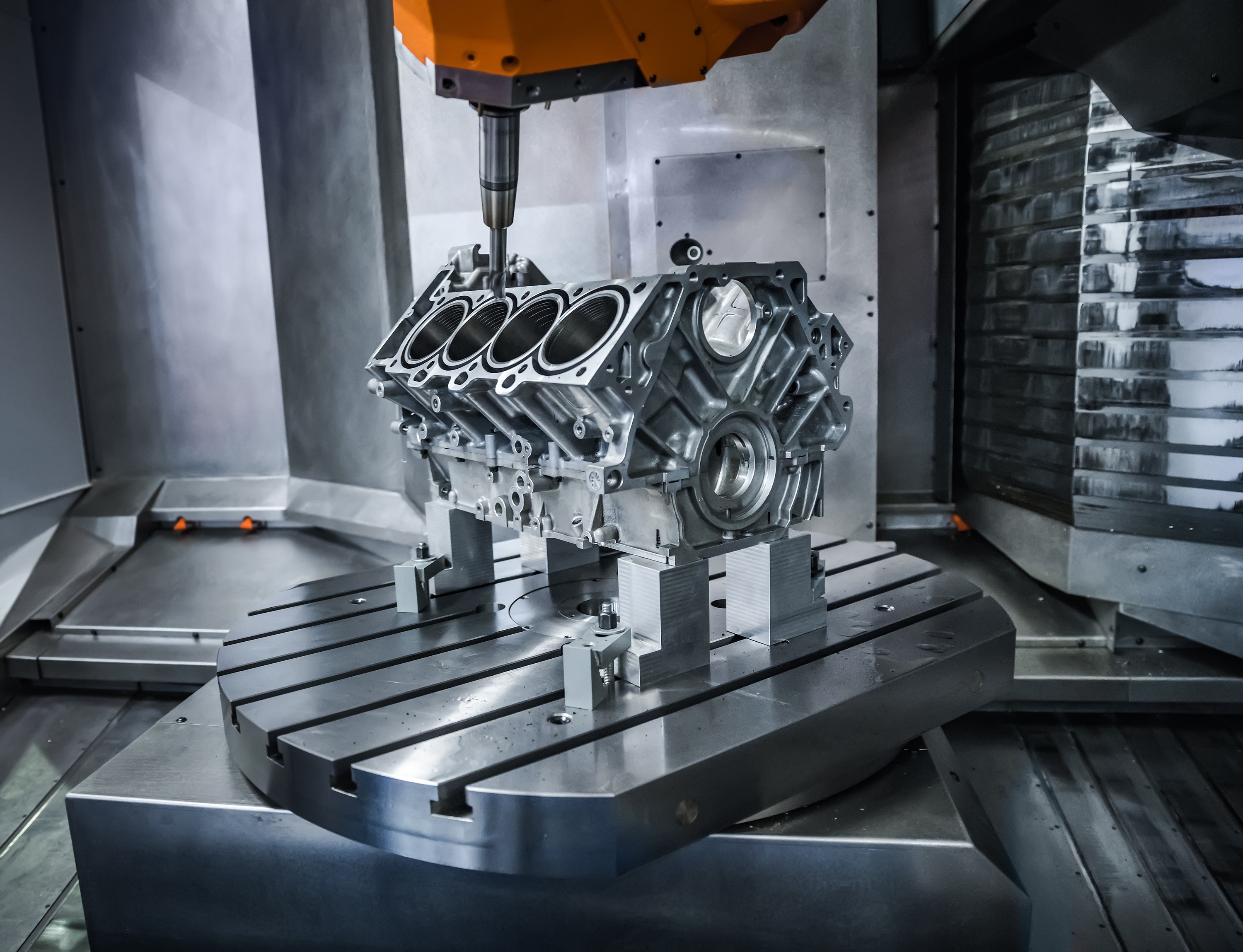CNC machine processing an engine block HD Wallpaper