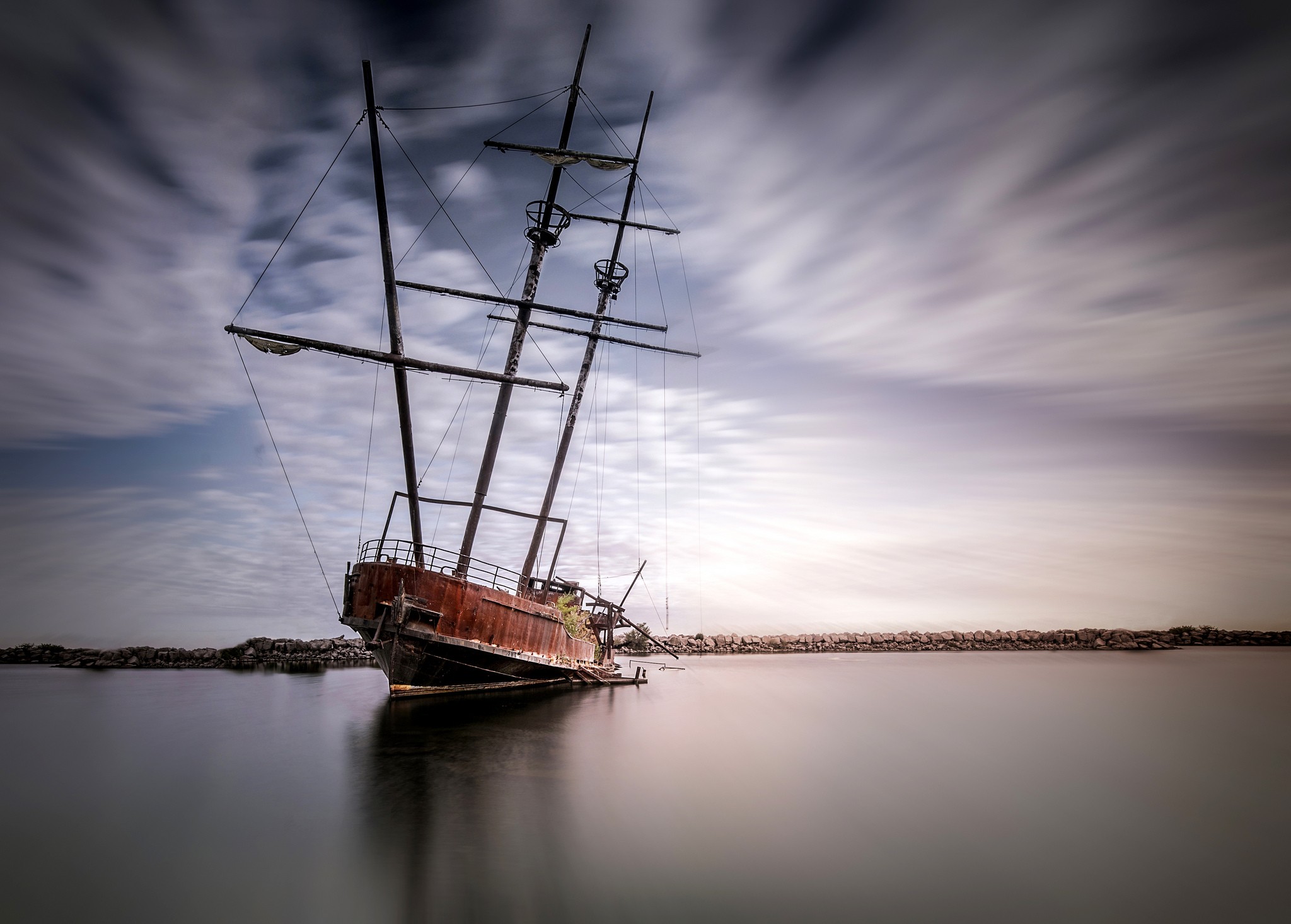 Abandoned ship on the water with streaky clouds HD Wallpaper