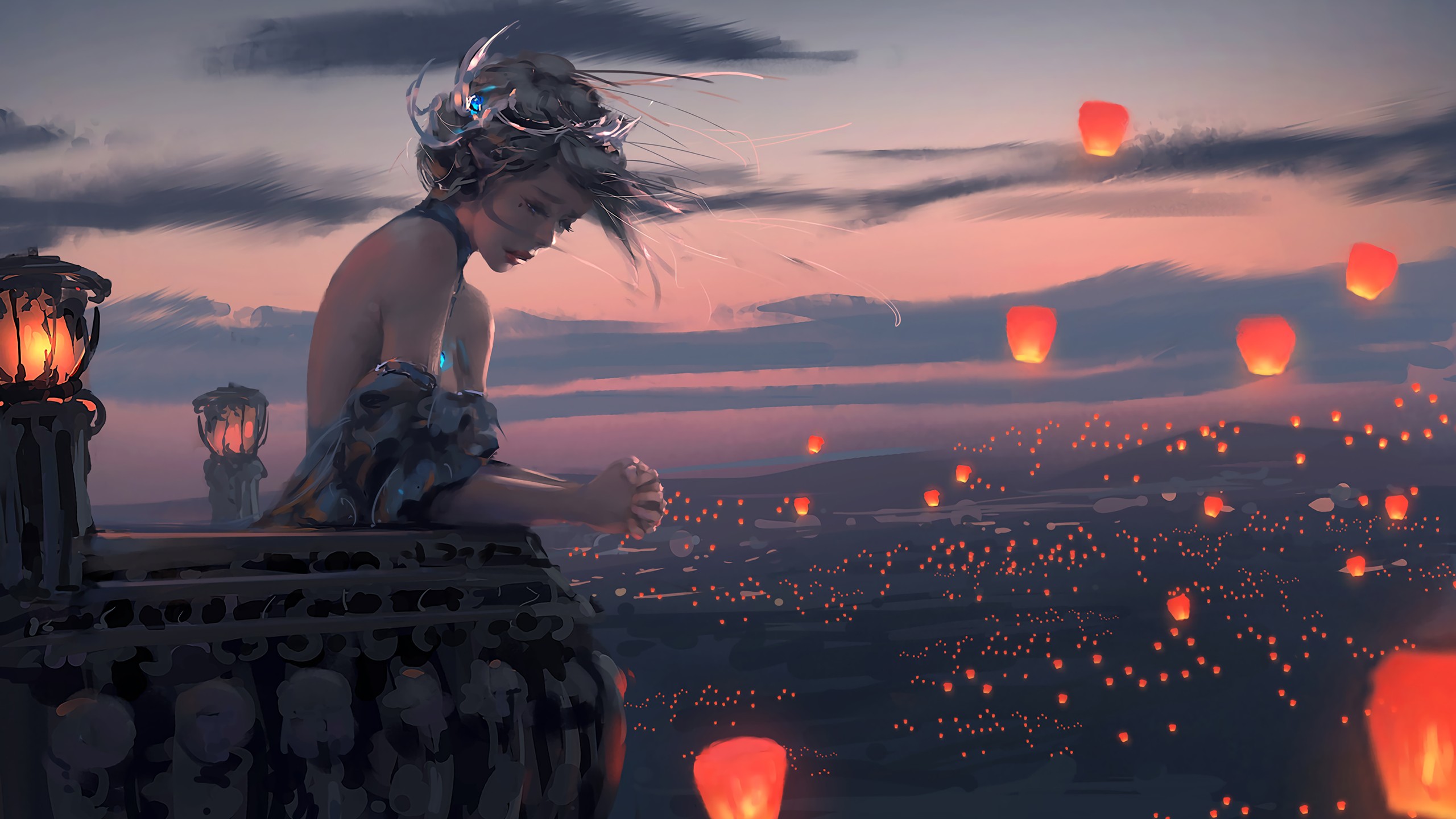 Woman on balcony releasing sky lanterns at dusk HD Wallpaper
