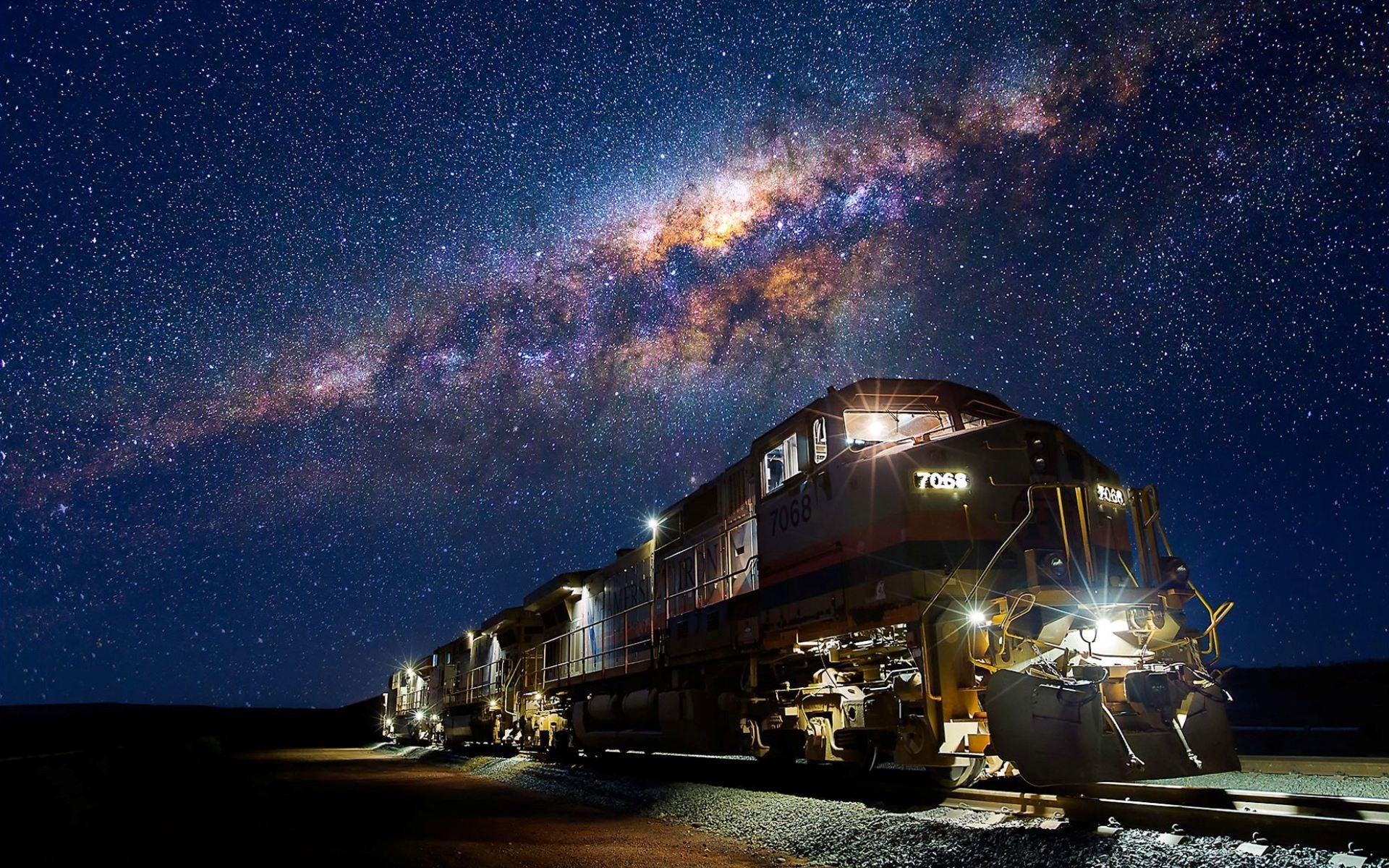 Train under the Milky Way at night HD Wallpaper