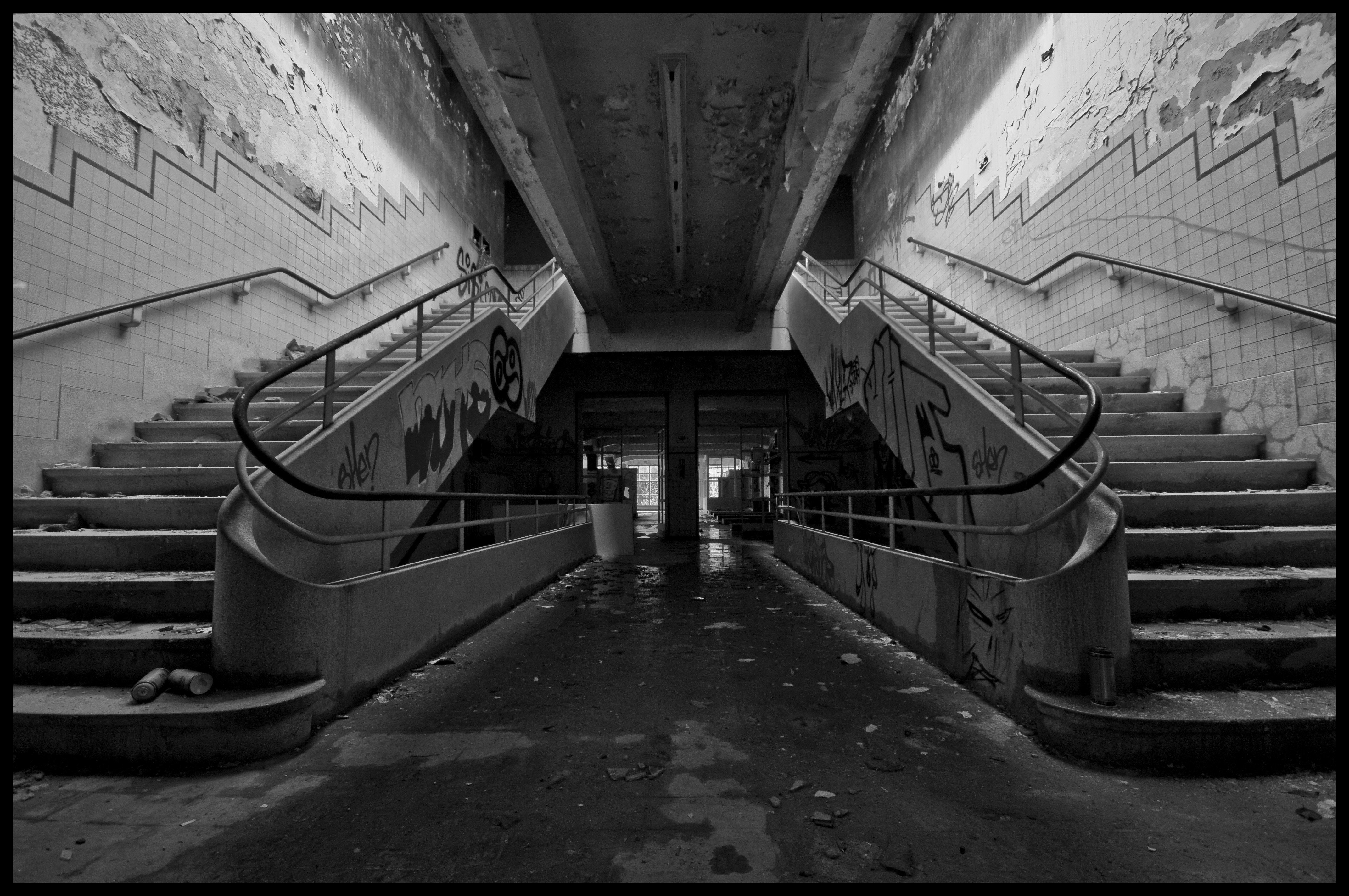 Abandoned train station with graffiti-covered stairs HD Wallpaper