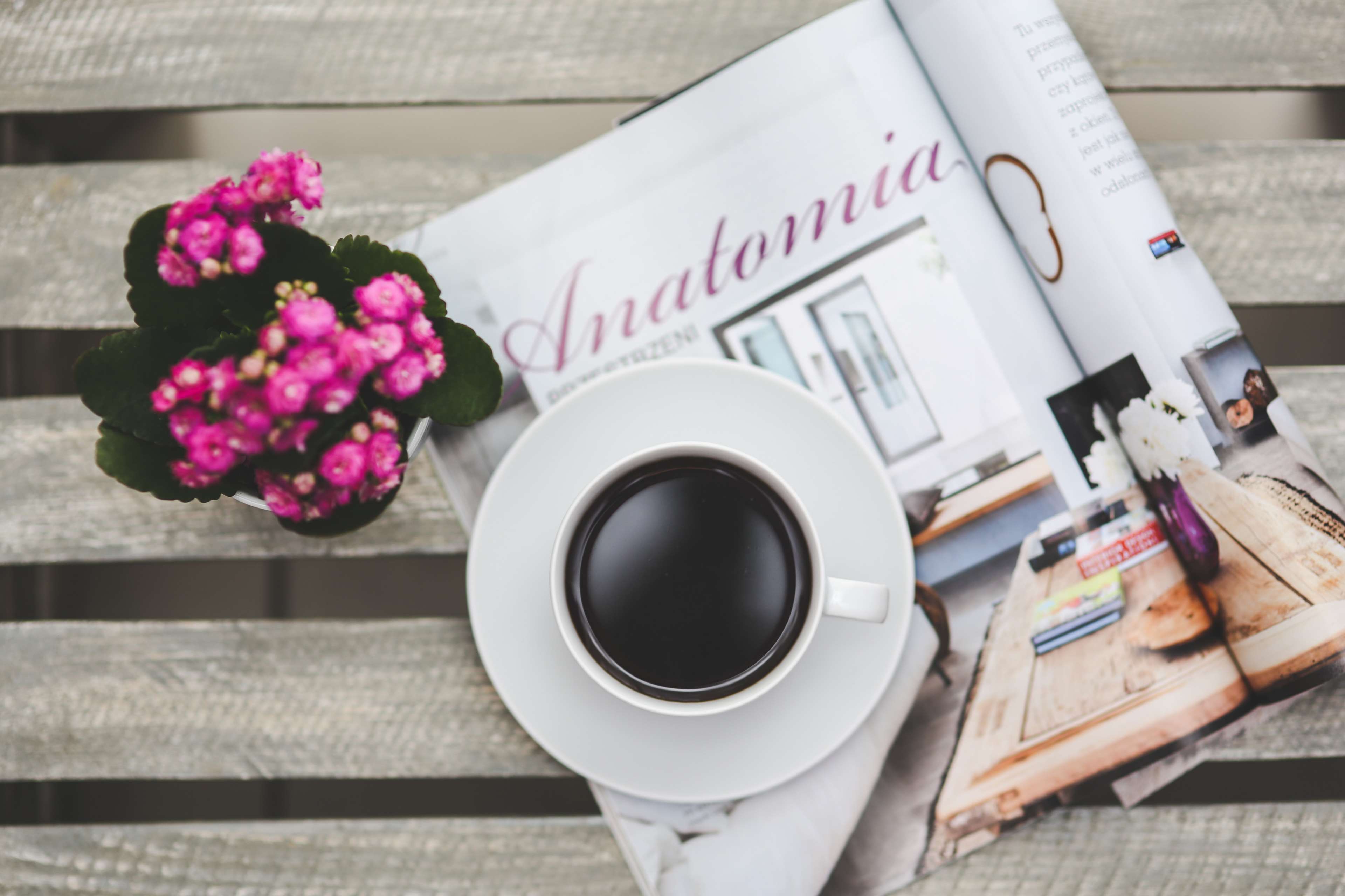 Cup of coffee on a magazine with pink flowers HD Wallpaper