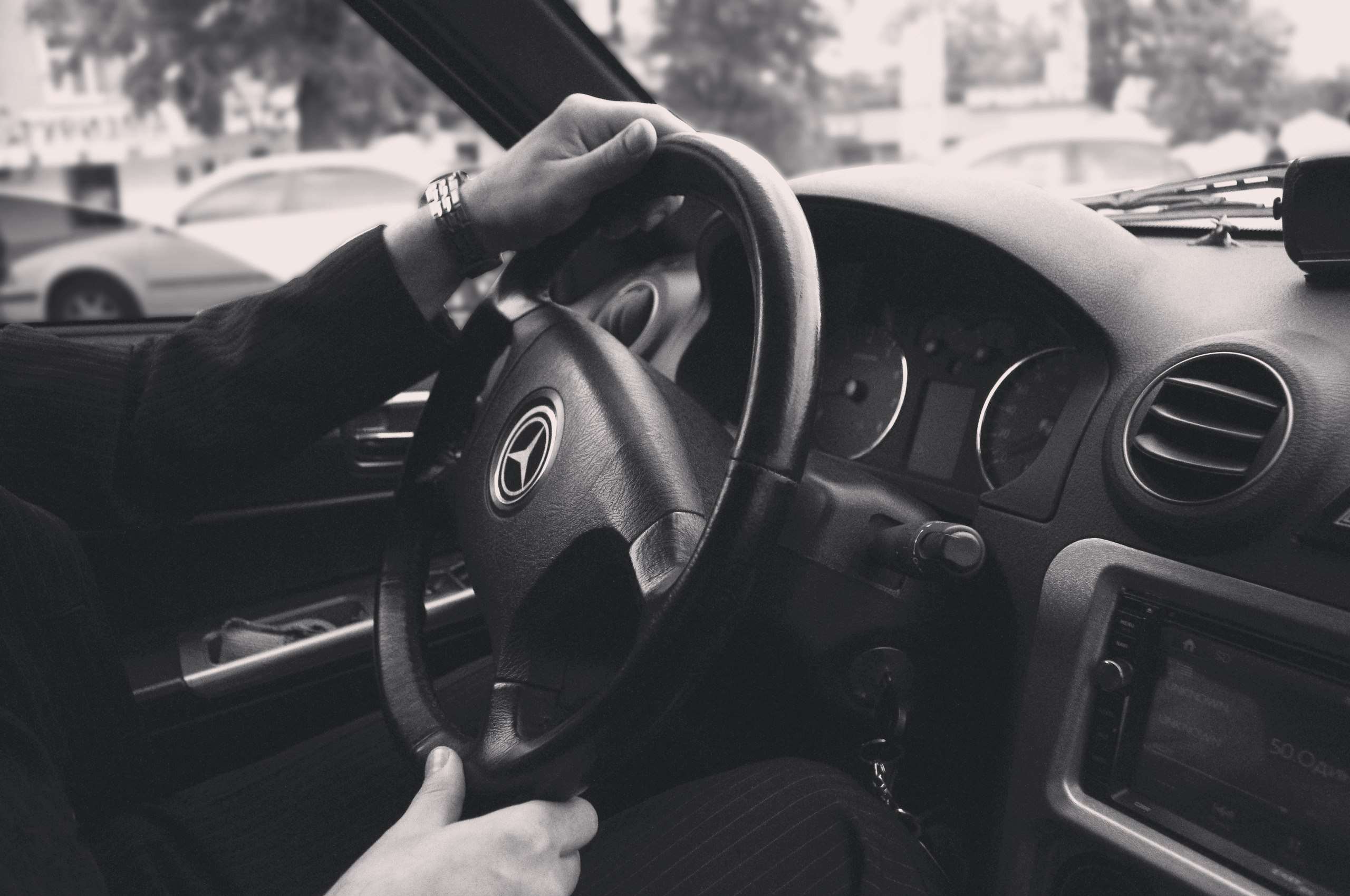 Man driving a Mercedes-Benz car HD Wallpaper