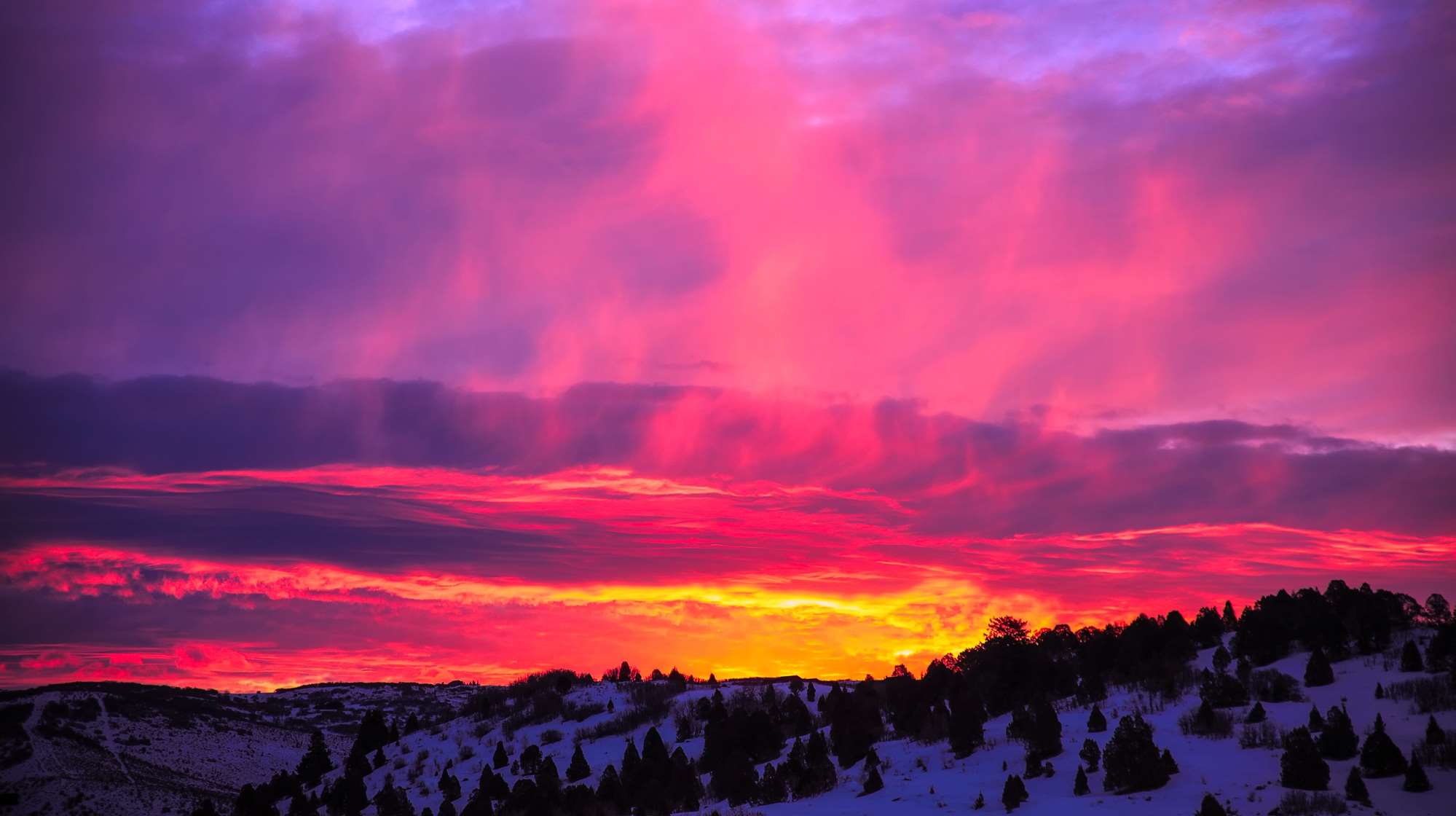 Snowy landscape with colorful sunset sky HD Wallpaper